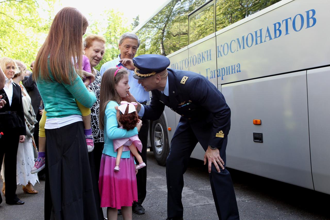 Expedition 36/37 Flight Engineer Luca Parmitano of the European Space Agency (right) says goodbye to his daughter May 16 before boarding a bus at the Gagarin Cosmonaut Training Center in Star City, Russia. Parmitano, Flight Engineer Karen Nyberg of NASA and Soyuz Commander Fyodor Yurchikhin flew to their launch site at the Baikonur Cosmodrome in Kazakhstan for final preparations for launch May 29, Kazakh time, in the Soyuz TMA-09M spacecraft and the start of a 5 ½ month mission on the International Space Station. NASA/Stephanie Stoll