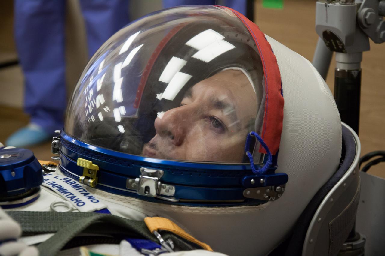 In the Integration Facility at the Baikonur Cosmodrome in Kazakhstan, Expedition 36/37 Flight Engineer Luca Parmitano of the European Space Agency strikes a thoughtful pose during a portion of a suited dress rehearsal “fit check” exercise May 17. Parmitano, NASA Flight Engineer Karen Nyberg and Soyuz Commander Fyodor Yurchikhin will launch May 29, Kazakh time, in their Soyuz TMA-09M spacecraft to begin a 5 ½ mission on the International Space Station. NASA/Victor Zelentsov