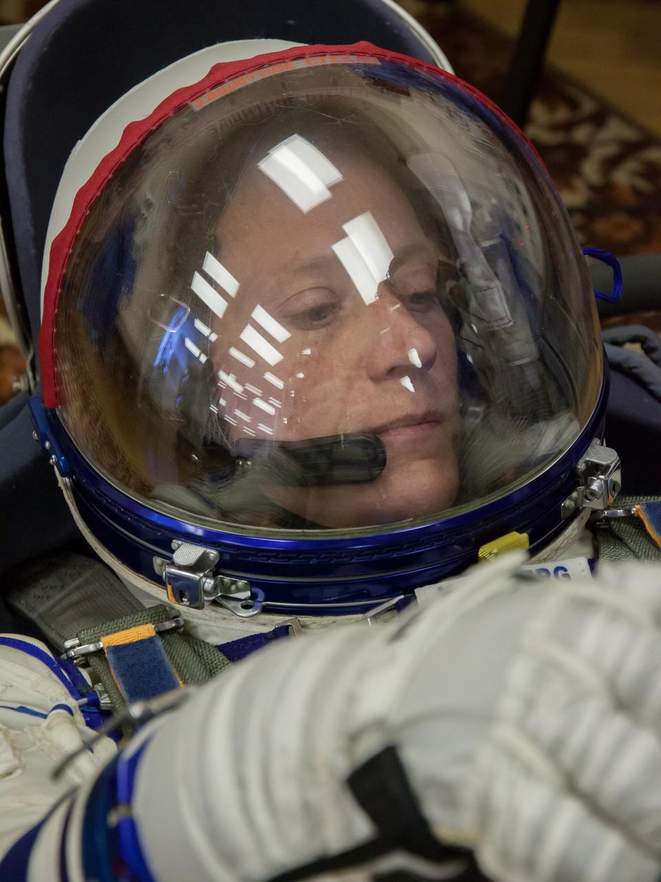 In the Integration Facility at the Baikonur Cosmodrome in Kazakhstan, Expedition 36/37 Flight Engineer Karen Nyberg of NASA strikes a thoughtful pose during a portion of a suited dress rehearsal “fit check” exercise May 17. Nyberg, Flight Engineer Luca Parmitano of the European Space Agency and Soyuz Commander Fyodor Yurchikhin will launch May 29, Kazakh time, in their Soyuz TMA-09M spacecraft to begin a 5 ½ mission on the International Space Station. NASA/Victor Zelentsov