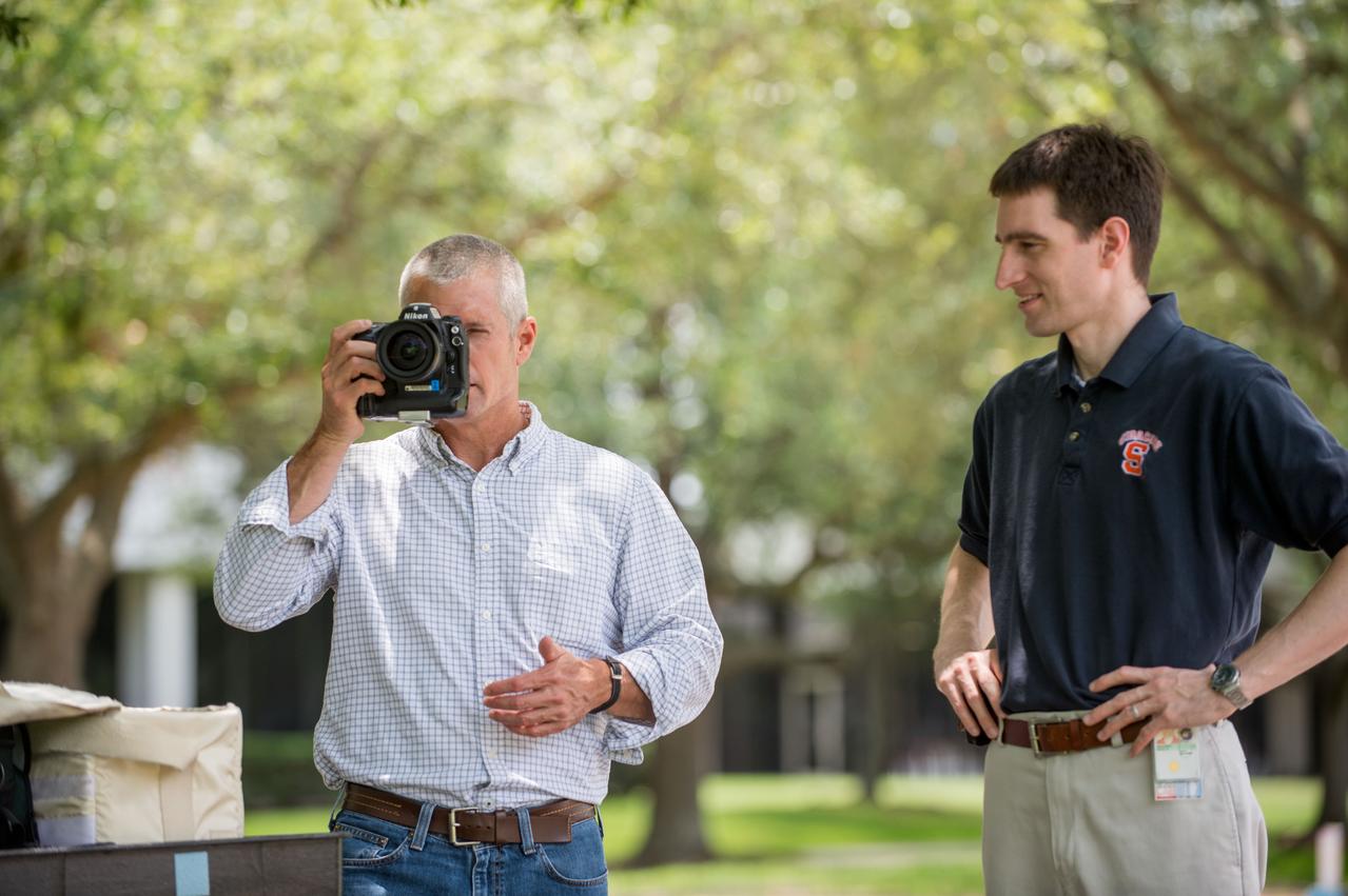 PHOTO DATE:   05-20-13 LOCATION: Bldg. 4south, Room  1303   SUBJECT: Soyuz 38 (Expedition 39/40) crew member Steve Swanson training on Nikon camera equipment and long lenses for External Photo Skills with instructor Paul Reichert. PHOTOGRAPHER: BILL STAFFORD