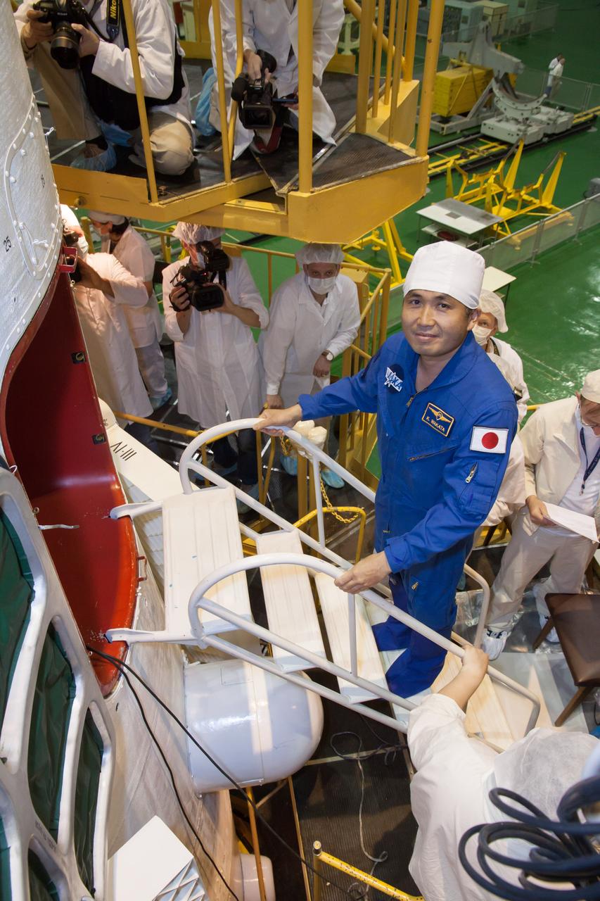 At the Baikonur Cosmodrome in Kazakhstan, Expedition 36/37 backup Flight Engineer Koichi Wakata of the Japan Aerospace Exploration Agency boards the Soyuz TMA-09M spacecraft in the Integration Facility May 24 in support of the final “fit check” dress rehearsal by the prime and backup crews. Wakata is supporting prime crewmembers Flight Engineer Karen Nyberg of NASA, Soyuz Commander Fyodor Yurchikhin and Flight Engineer Luca Parmitano of the European Space Agency, who are preparing for launch May 29, Kazakh time, in the Soyuz to begin a 5 ½ month mission on the International Space Station.  NASA/Victor Zelentsov 