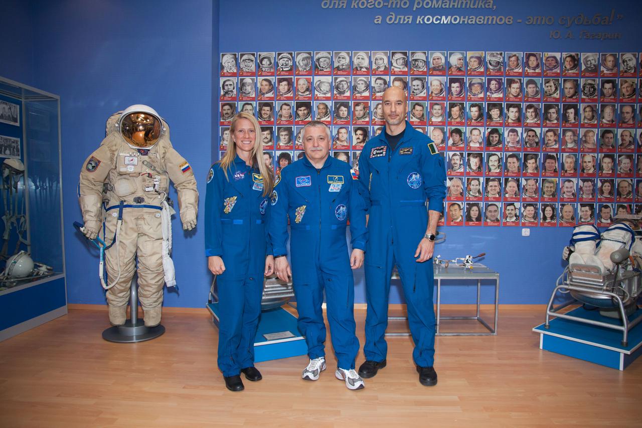 At the Baikonur Cosmodrome in Kazakhstan, Expedition 36/37 Flight Engineer Karen Nyberg of NASA (left), Soyuz Commander Fyodor Yurchikhin (center) and Flight Engineer Luca Parmitano of the European Space Agency (right) pose for pictures in the Korolev Museum May 24 following the final “fit check” dress rehearsal before launch. Nyberg, Yurchikhin and Parmitano are preparing for launch May 29, Kazakh time, in the Soyuz TMA-09M spacecraft to begin a 5 ½ month mission on the International Space Station. NASA/Victor Zelentsov