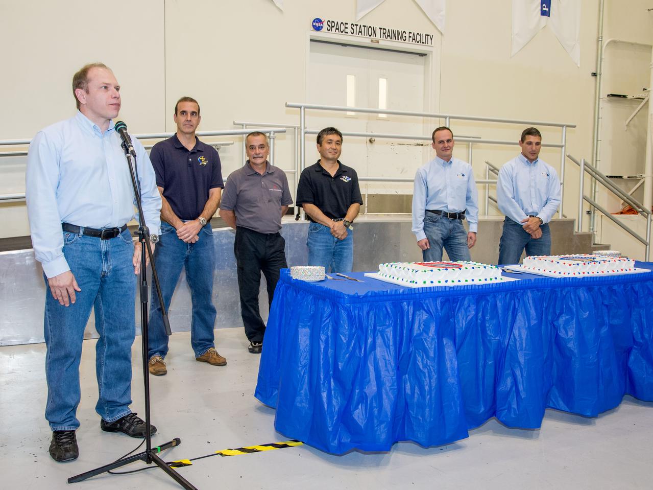 Date: 07-03-13 Location: Bldg 5, SSTF High Bay Subject: Expedition 38 (Soyuz 36 & 37) crew members during cake ceremony marking the end of their training. Photographer: James Blair