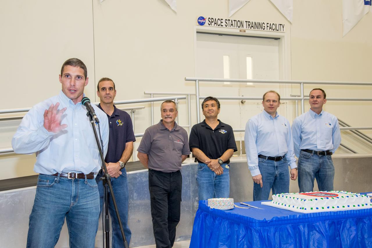Date: 07-03-13 Location: Bldg 5, SSTF High Bay Subject: Expedition 38 (Soyuz 36 & 37) crew members during cake ceremony marking the end of their training. Photographer: James Blair