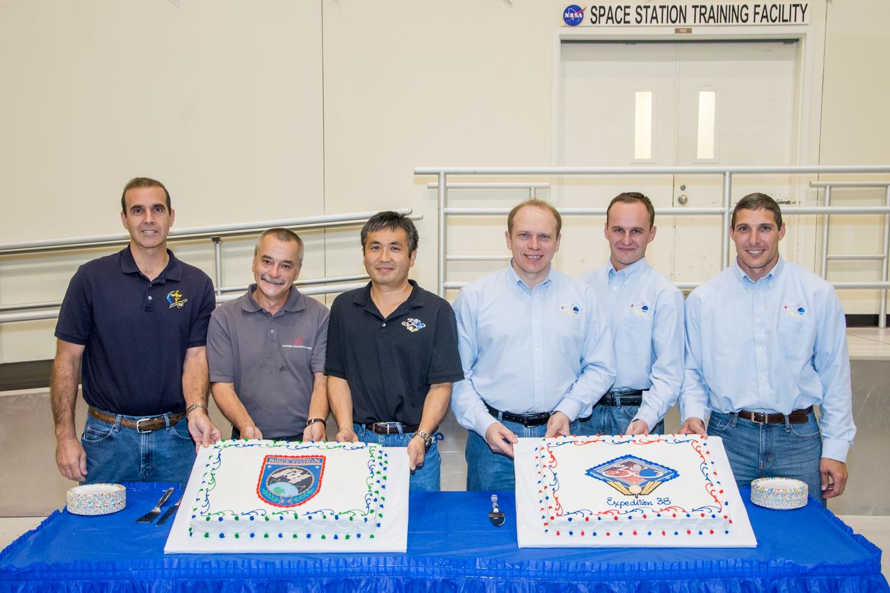 Date: 07-03-13 Location: Bldg 5, SSTF High Bay Subject: Expedition 38 (Soyuz 36 & 37) crew members during cake ceremony marking the end of their training. Photographer: James Blair