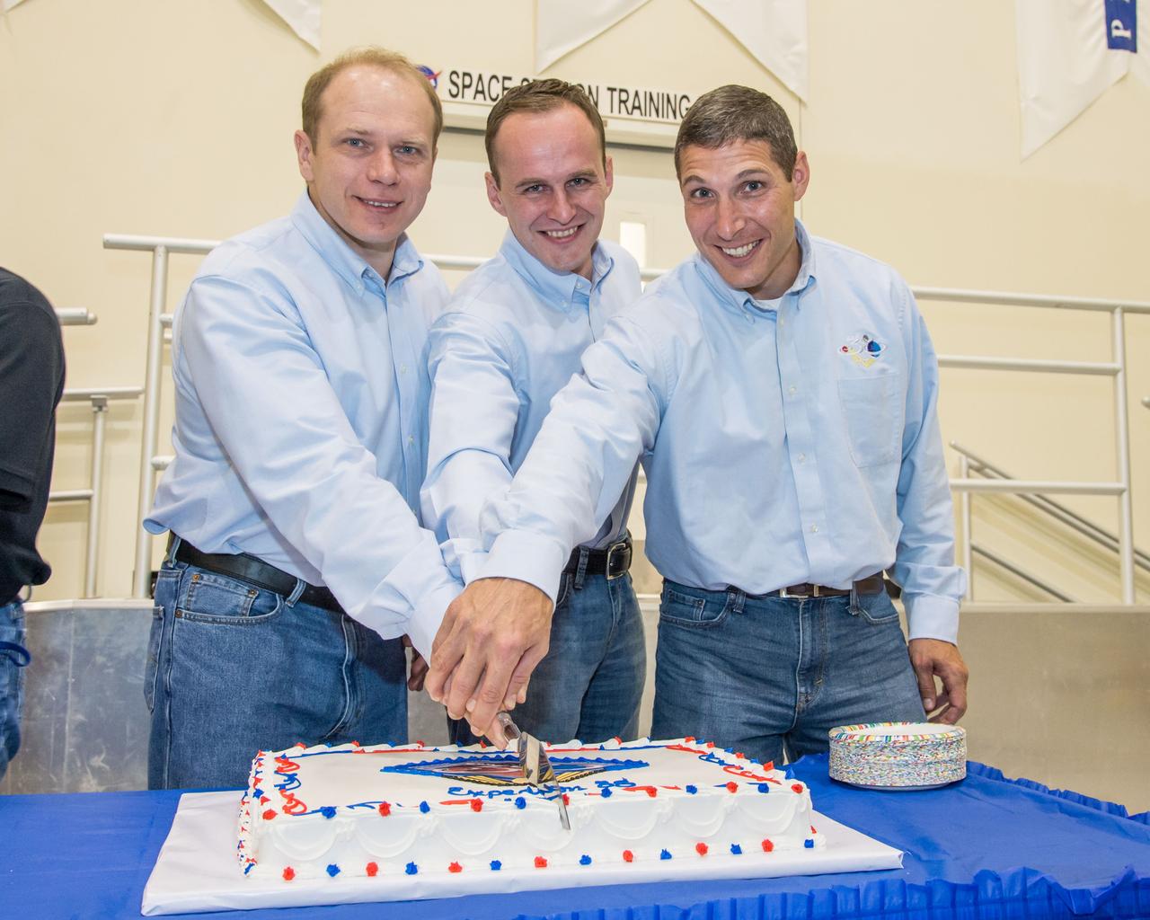 Date: 07-03-13 Location: Bldg 5, SSTF High Bay Subject: Expedition 38 (Soyuz 36 & 37) crew members during cake ceremony marking the end of their training. Photographer: James Blair