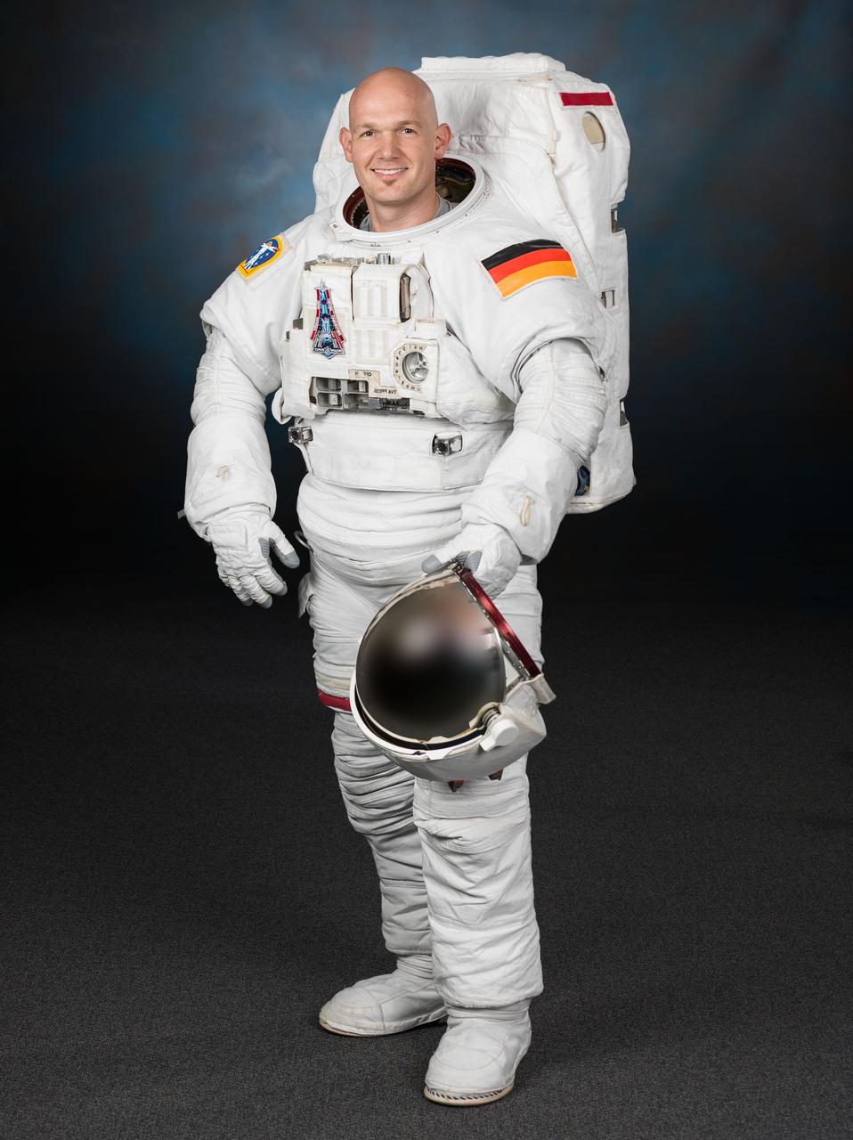 Official portrait of ESA astronaut Alexander Gerst in an EMU suit.  Photo Date: June 3, 2013.  Location: Building 8, Room 183 - Photo Studio.  Photographer: Robert Markowitz