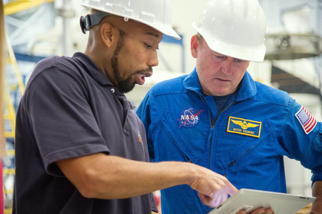 PHOTO DATE: 29 July 2013 LOCATION: Bldg. 9NW, Space Vehicle Mockup Training Facility - POGO SUBJECT: Expedition 42 crew member and astronaut Barry "Butch" Wilmore during ISS EVA POGO 1 training. Instructors Faruq Sabur (black shirt), Allissa Battocletti (red shirt), Sandy Fletcher (light blue shirt with glasses) and astronaut Shane Kimbrough assist.  PHOTOGRAPHER: Mark Sowa