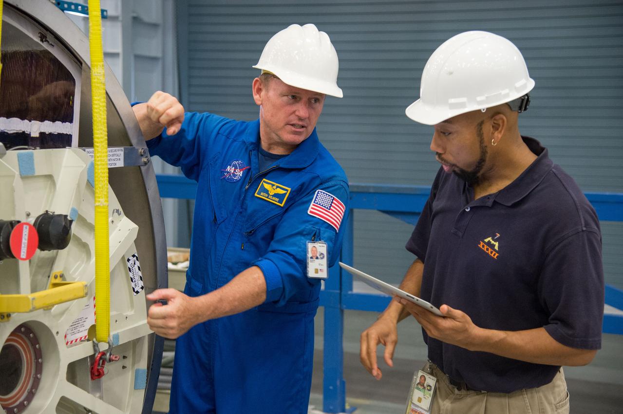 PHOTO DATE: 29 July 2013 LOCATION: Bldg. 9NW, Space Vehicle Mockup Training Facility - POGO SUBJECT: Expedition 42 crew member and astronaut Barry "Butch" Wilmore during ISS EVA POGO 1 training. Instructors Faruq Sabur (black shirt), Allissa Battocletti (red shirt), Sandy Fletcher (light blue shirt with glasses) and astronaut Shane Kimbrough assist.  PHOTOGRAPHER: Mark Sowa