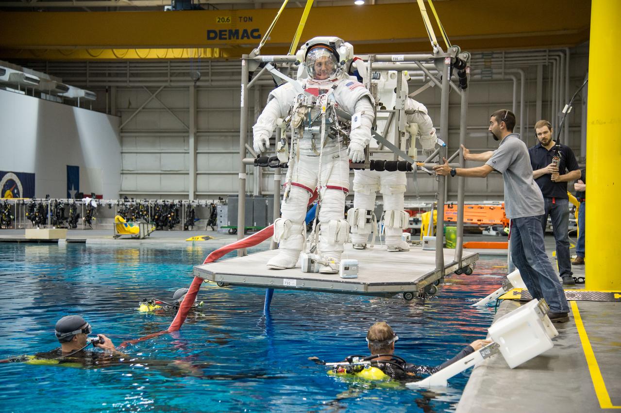 PHOTO DATE:  08-08-13 LOCATION:  NBL - Pool Topside SUBJECT: Expedition 44 crew members Kjell Lindren and Kimiya Yui (JAXA) during INC-44 ISS EVA Maintence PHOTOGRAPHER: BILL STAFFORD