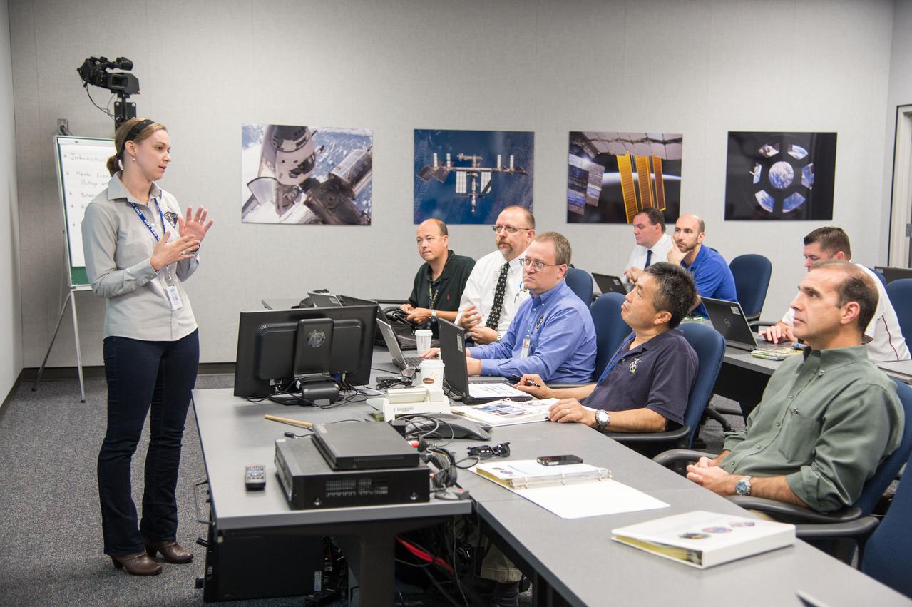 Expedition 39 “Increment Specific System Update” briefing for Soyuz 37 crew (Wakata, Tyurin, Mastracchio), which is supported by 19 flight control team disciplines and gives the upcoming crew a quick review of the entire vehicle’s current health, status and upcoming operations. Photo Date: August 30, 2013.  Location: Building 5s, Room 3102.  Photographer: Robert Markowitz