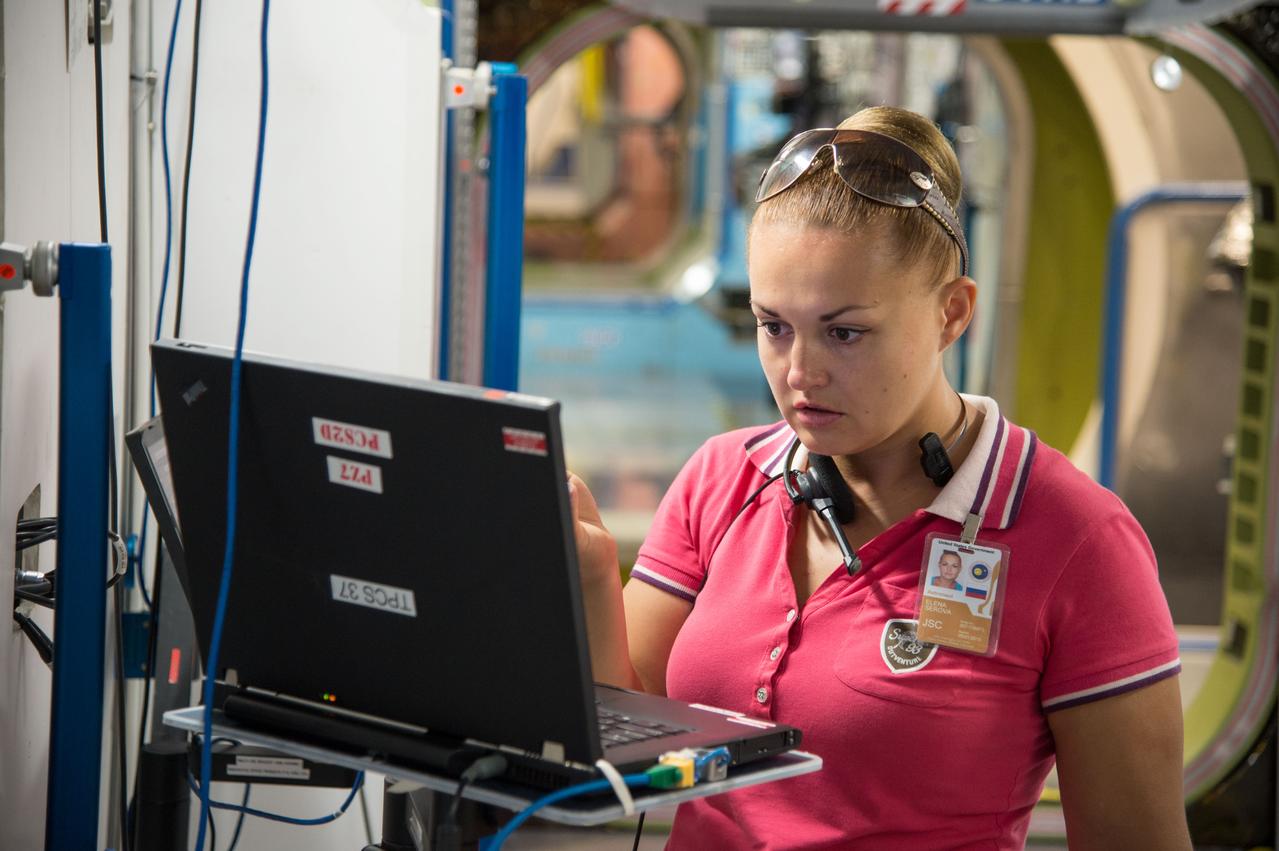 Date: 09-05-13 Location: Bldg 9NW, ISS Mockups Subject: Soyuz 40 (Expedition 41/42) Russian cosmonaut Yelena Serova during Routine Ops FS training in ISS mockups Photographer: James Blair/NASA