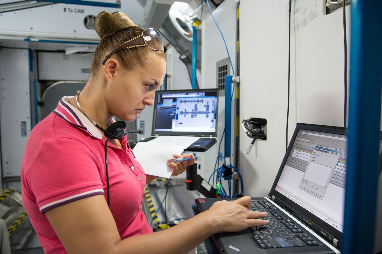 Date: 09-05-13 Location: Bldg 9NW, ISS Mockups Subject: Soyuz 40 (Expedition 41/42) Russian cosmonaut Yelena Serova during Routine Ops FS training in ISS mockups Photographer: James Blair/NASA