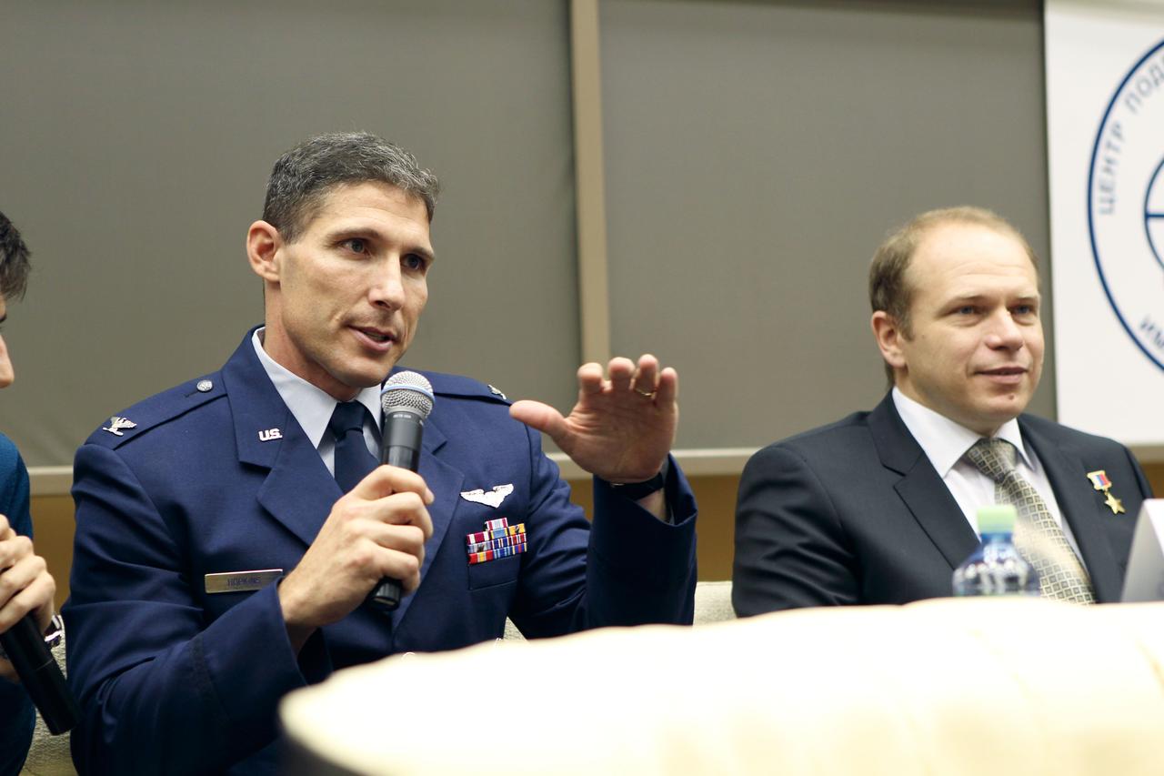 At the Gagarin Cosmonaut Training Center in Star City, Russia, Expedition 37/38 Flight Engineer Michael Hopkins of NASA answers a question from a reporter at a pre-launch news conference Sept. 6 as his crewmate, Soyuz Commander Oleg Kotov (right) looks on. Along with Flight Engineer Sergey Ryazanskiy, Hopkins and Kotov are preparing for their launch to the International Space Station from the Baikonur Cosmodrome in Kazakhstan on Sept. 26, Kazakh time, aboard the Soyuz TMA-10M spacecraft  NASA/Stephanie Stoll