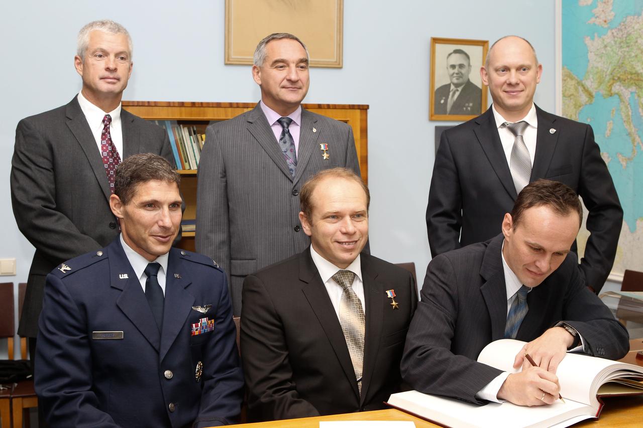 At the Gagarin Cosmonaut Training Center in Star City, Russia, Expedition 37/38 Flight Engineer Sergey Ryazanskiy (right, front row) signs a certification book in a traditional ceremony Sept. 6 as his prime and backup crewmates look on. In the front row are prime crewmates NASA Flight Engineer Michael Hopkins (left) and Soyuz Commander Oleg Kotov (center). In the back row are backup crewmembers Steve Swanson of NASA (left), Alexander Skvortsov (center) and Oleg Artemyev (right). Hopkins, Kotov and Ryazanskiy are preparing for their launch to the International Space Station from the Baikonur Cosmodrome in Kazakhstan on Sept. 26, Kazakh time, aboard the Soyuz TMA-10M spacecraft.  NASA/Stephanie Stoll