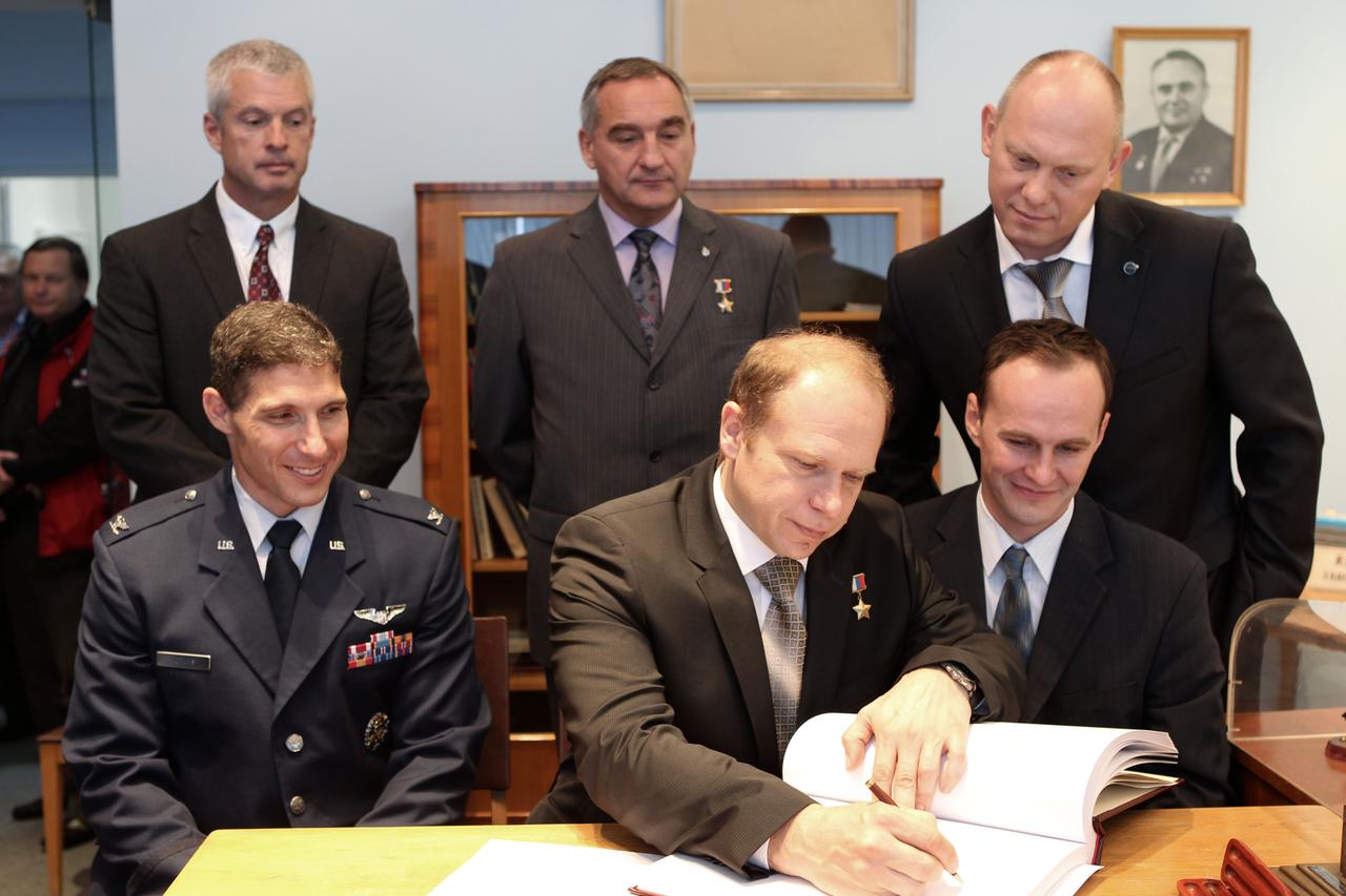 At the Gagarin Cosmonaut Training Center in Star City, Russia, Expedition 37/38 Soyuz Commander Oleg Kotov (front row, center) signs a certification book in a traditional ceremony Sept. 6 as his prime and backup crewmates look on. In the front row are prime crewmates NASA Flight Engineer Michael Hopkins (left) and Flight Engineer Sergey Ryazanskiy (right). In the back row are backup crewmembers Steve Swanson of NASA (left), Alexander Skvortsov (center) and Oleg Artemyev (right). Hopkins, Kotov and Ryazanskiy are preparing for their launch to the International Space Station from the Baikonur Cosmodrome in Kazakhstan on Sept. 26, Kazakh time, aboard the Soyuz TMA-10M spacecraft.  NASA/Stephanie Stoll