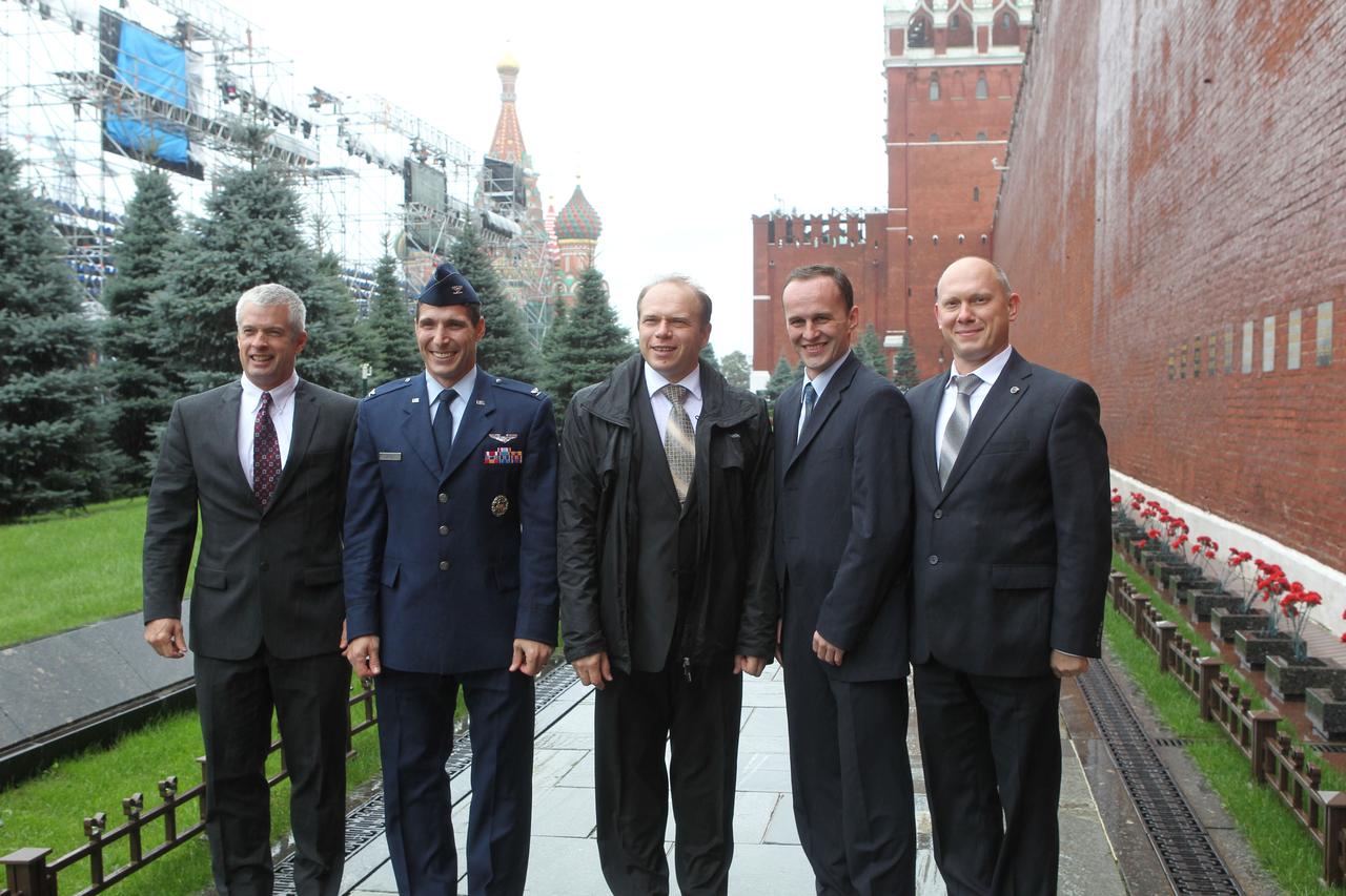 At the Kremlin Wall at Red Square in Moscow, Five of the six Expedition 37/38 prime and backup crewmembers pose for pictures Sept. 6 during the traditional visit to lay flowers at the wall where Russian space icons are interred. With the onion domed spires of St. Basil’s Cathedral in the background, from left to right are backup NASA Flight Engineer Steve Swanson, prime Flight Engineer Michael Hopkins of NASA, prime Soyuz Commander Oleg Kotov, prime Flight Engineer Sergey Ryazanskiy and backup Flight Engineer Oleg Artemyev. Hopkins, Kotov and Ryazanskiy are preparing for their launch to the International Space Station from the Baikonur Cosmodrome in Kazakhstan on Sept. 26, Kazakh time, aboard the Soyuz TMA-10M spacecraft.  NASA/Stephanie Stoll