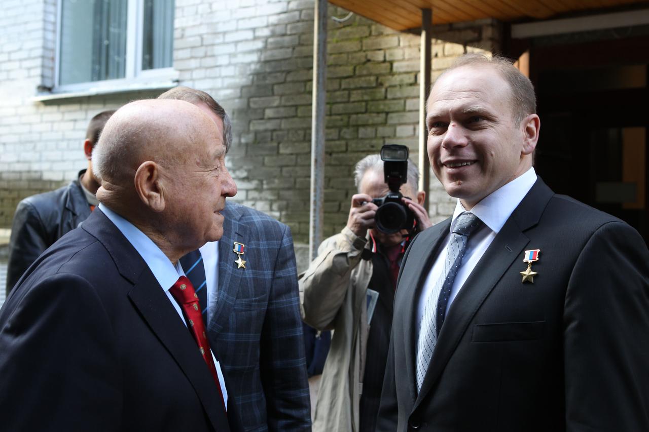 At the Gagarin Cosmonaut Training Center in Star City, Russia, Russian cosmonaut Alexei Leonov (left), the first human to walk in space, shares a light moment with Expedition 37/38 Soyuz Commander Oleg Kotov (right) Sept. 13 before Kotov, Flight Engineer Sergey Ryazanskiy, Flight Engineer Michael Hopkins of NASA and their backups departed with their backup crewmates for the Baikonur Cosmodrome in Kazakhstan. Hopkins, Kotov and Ryazanskiy will launch from Baikonur Sept. 26, Kazakh time, in the Soyuz TMA-10M spacecraft for a five and a half month mission on the International Space Station.  NASA/Stephanie Stoll 
