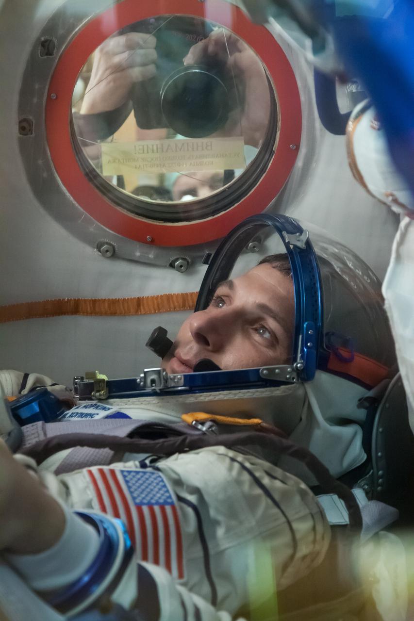 At the Baikonur Cosmodrome in Kazakhstan, Expedition 37/38 Flight Engineer Michael Hopkins of NASA runs through his procedures inside the Soyuz TMA-10M spacecraft Sept. 14 as part of a “fit check” dress rehearsal training exercise. Hopkins, Soyuz Commander Oleg Kotov and Flight Sergey Ryazanskiy are preparing for launch Sept. 26, Kazakh time, from Baikonur on their Soyuz vehicle to begin a five and a half month mission on the International Space Station.  NASA/Victor Zelentsov 