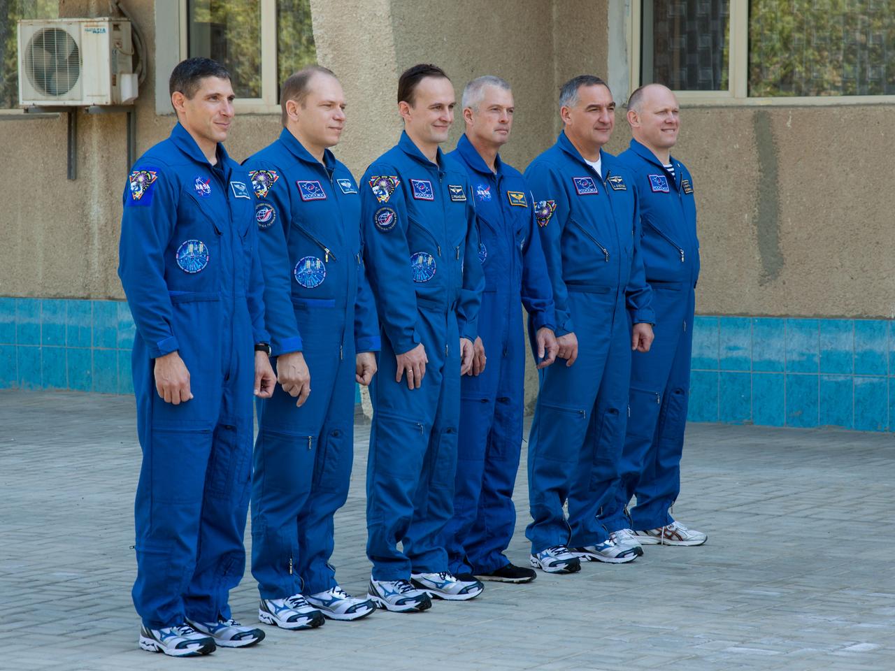 At their Cosmonaut Hotel crew quarters in Baikonur, Kazakhstan, the Expedition 37/38 prime and backup crewmembers participate in ceremonies following the traditional raising of U.S., Russian and Kazakh flags Sept. 15. From left to right are prime crewmembers Michael Hopkins of NASA, Oleg Kotov and Sergey Ryazanskiy and their backups, Steve Swanson of NASA, Alexander Skvortsov and Oleg Artemyev. Hopkins, Kotov and Ryazanskiy are preparing for launch Sept. 26, Kazakh time, from Baikonur on their Soyuz TMA-10M spacecraft to begin a five and a half month mission on the International Space Station. NASA/Victor Zelentsov