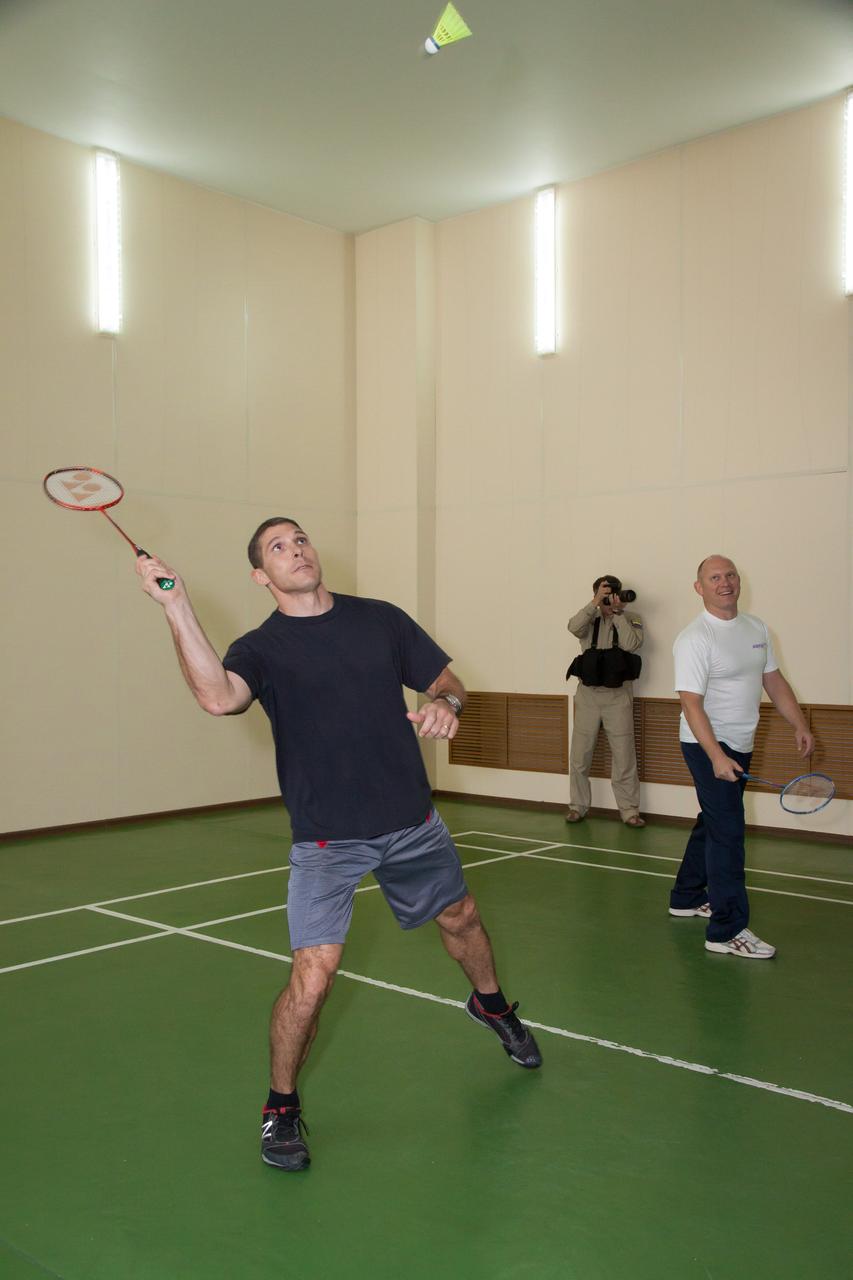 Under the watchful eye of backup crewmember Oleg Artemyev (right), Expedition 37/38 Flight Engineer Michael Hopkins of NASA plays a game of badminton at the Cosmonaut Hotel crew quarters in Baikonur, Kazakhstan Sept. 18. Hopkins, Soyuz Commander Oleg Kotov and Flight Engineer Sergey Ryazanskiy are set to launch Sept. 26, Kazakh time, from the Baikonur Cosmodrome on their Soyuz TMA-10M spacecraft for a five and a half month mission on the International Space Station.  NASA/Victor Zelentsov 