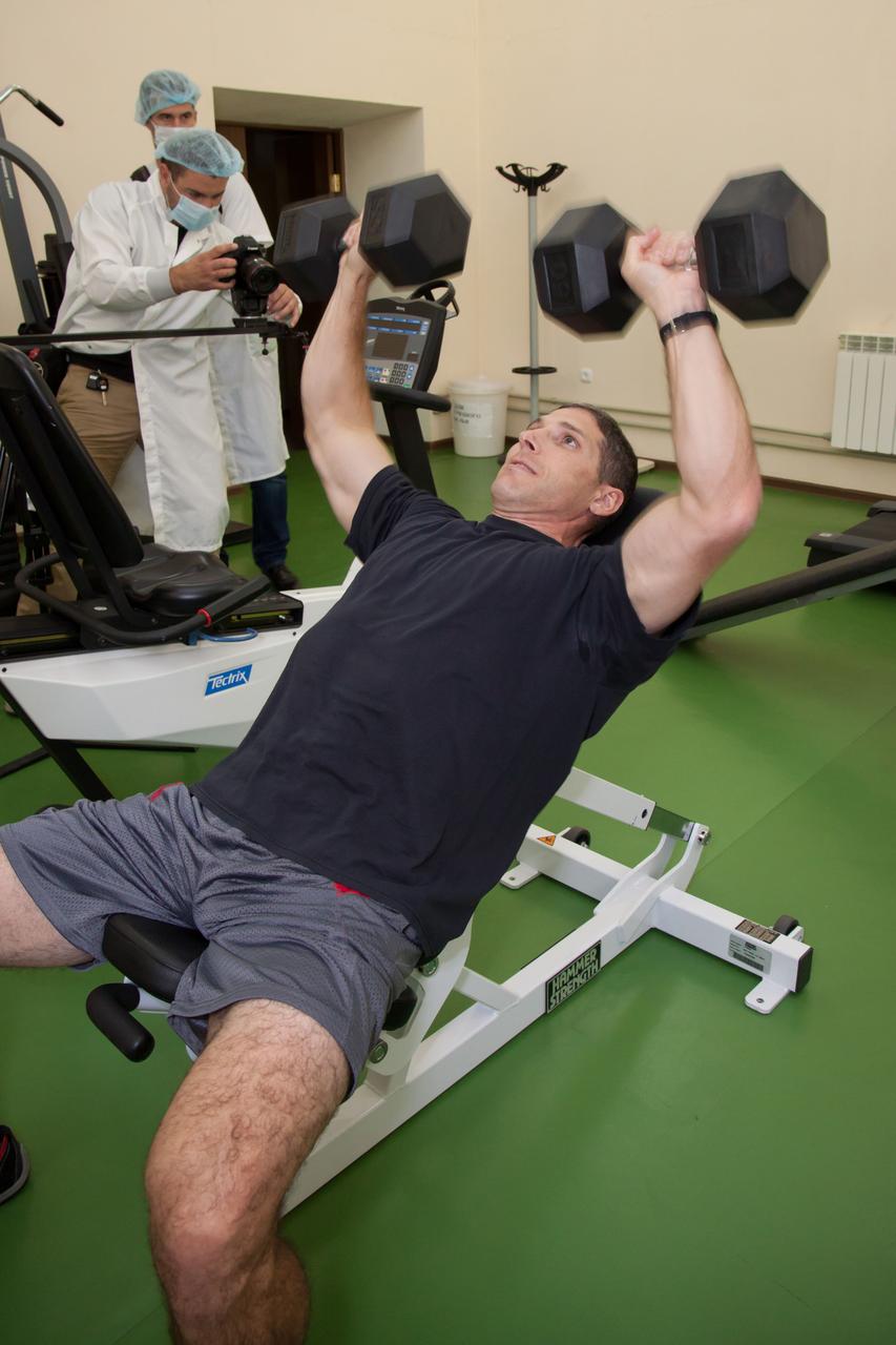 At his Cosmonaut Hotel crew quarters in Baikonur, Kazakhstan, Expedition 37/38 Flight Engineer Michael Hopkins of NASA engages in a round of weightlifting Sept. 18 as part of a media availability for reporters and photographers. Hopkins, Soyuz Commander Oleg Kotov and Flight Engineer Sergey Ryazanskiy are set to launch Sept. 26, Kazakh time, from the Baikonur Cosmodrome on their Soyuz TMA-10M spacecraft for a five and a half month mission on the International Space Station.  NASA/Victor Zelentsov 