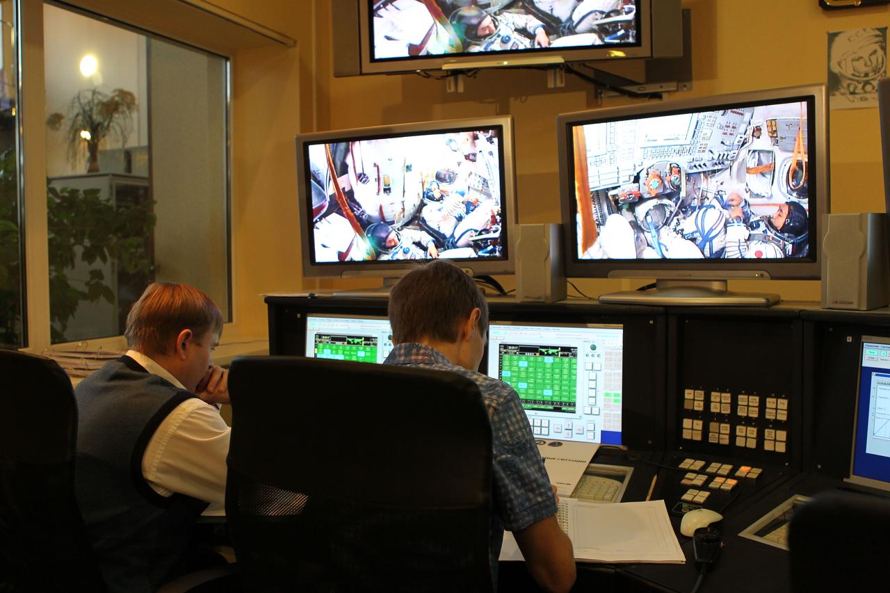 At the Gagarin Cosmonaut Training Center in Star City, Russia, trainers monitor a simulation run by Expedition 38/39 Soyuz Commander Mikhail Tyurin, NASA Flight Engineer Rick Mastracchio and Flight Engineer Koichi Wakata of the Japan Aerospace Exploration Agency Oct. 17, 2013. The simulation was part of the final qualifications exams for the crew, which is scheduled to launch on Nov. 7, local time, from the Baikonur Cosmodrome in Kazakhstan on the Soyuz TMA-11M spacecraft for a six-month mission on the International Space Station.  NASA/Stephanie Stoll 