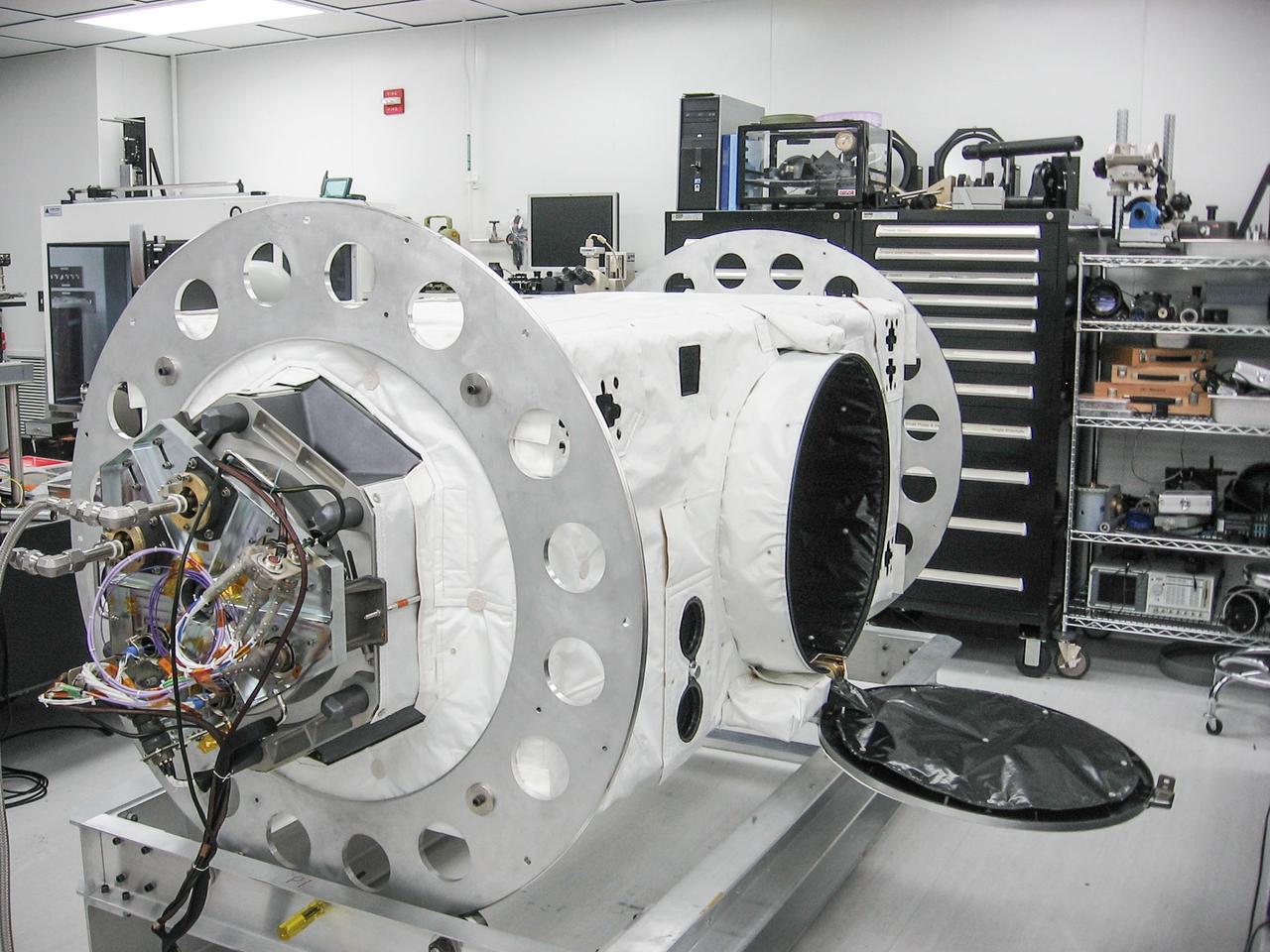 jsc2013e090265 (Sep. 26, 2013) --- Cloud Aerosol Transport System (CATS) at NASA's Johnson Space Center undergoing payload fit-check and Support Equipment Installation (SEI). The CATS investigation uses a light detection and ranging (LiDAR) system to measure the location, composition and distribution of pollution, dust, smoke, aerosols and other particulates in the atmosphere. CATS is used to study the atmospheric constituents that impact global climate. By gaining a better understanding of cloud and aerosol coverage, scientists can create a better model of the Earth's climate feedback processes.