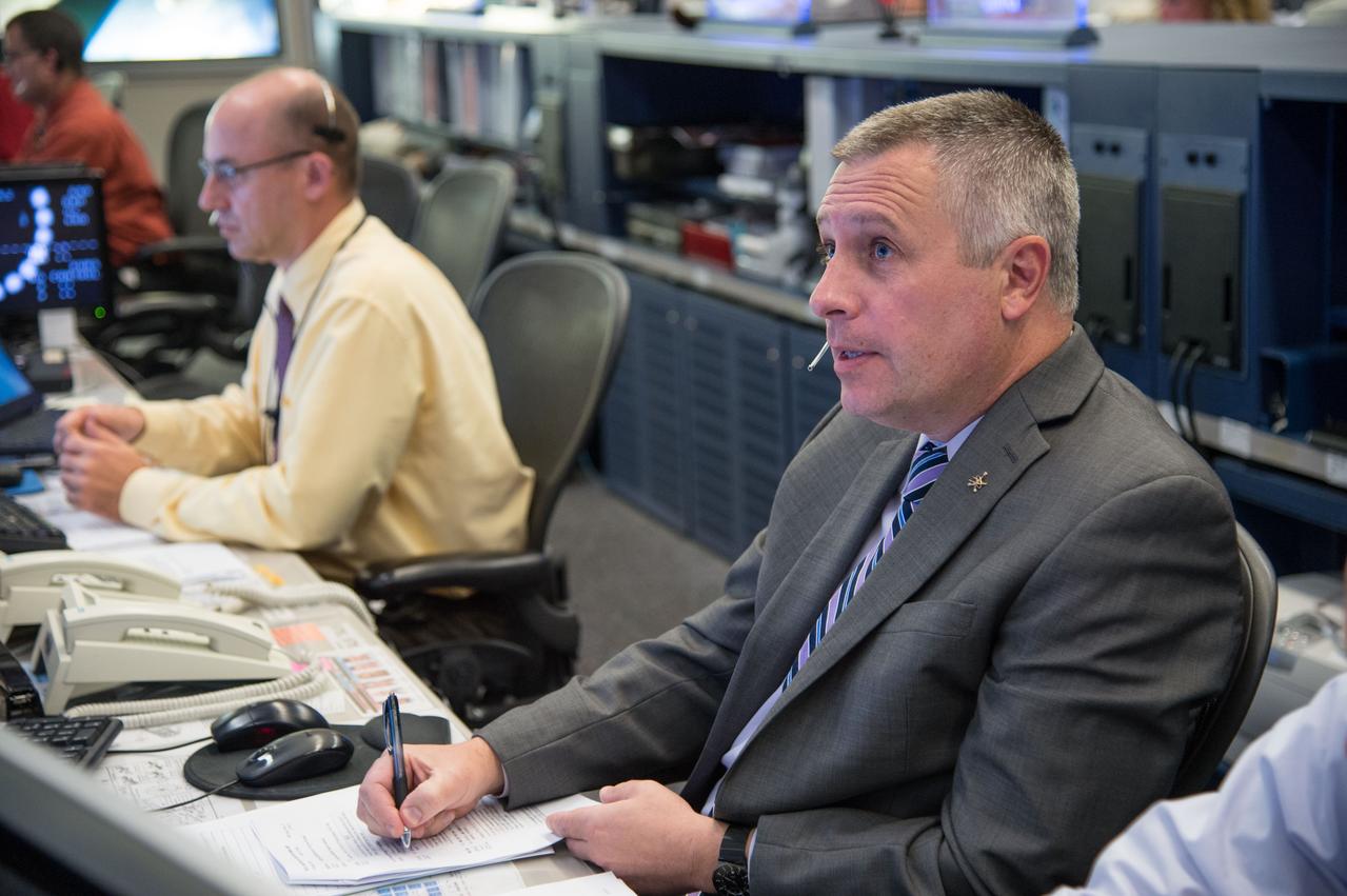 Photographic coverage of Expedition 37 flight controllers on console with Flight Director's Jerry Jason and Tony Ceccacci during the undocking of Europe's 4th Automated Transfer Vehicle (ATV) from the International Space Station. Photo Date: October 28, 2013. Location: Building 30 - FCR1. Photographer: Robert Markowitz