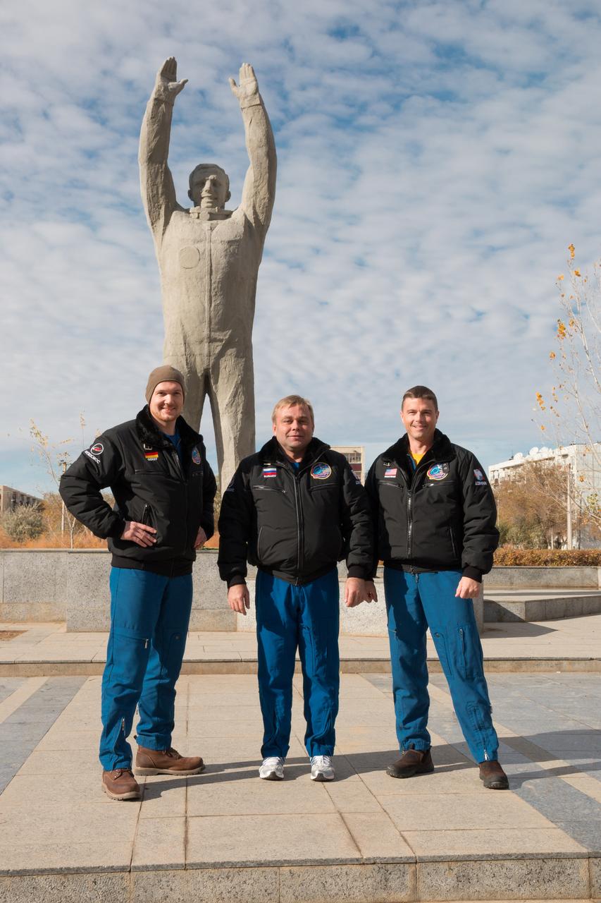 The Expedition 38/39 backup crewmembers pose for pictures in front of a statue of Yuri Gagarin, the first human to fly in space, during a tour of the city of Baikonur, Kazakhstan October 27. Alexander Gerst of the European Space Agency (left), Max Suraev (center) and Reid Wiseman of NASA (right) are understudies to the prime crew, Koichi Wakata of the Japan Aerospace Exploration Agency, Soyuz Commander Mikhail Tyurin and Rick Mastracchio of NASA, who will launch Nov. 7, Kazakh time, in the Soyuz TMA-11M spacecraft from Baikonur to begin a six-month mission on the International Space Station. NASA/Victor Zelentsov