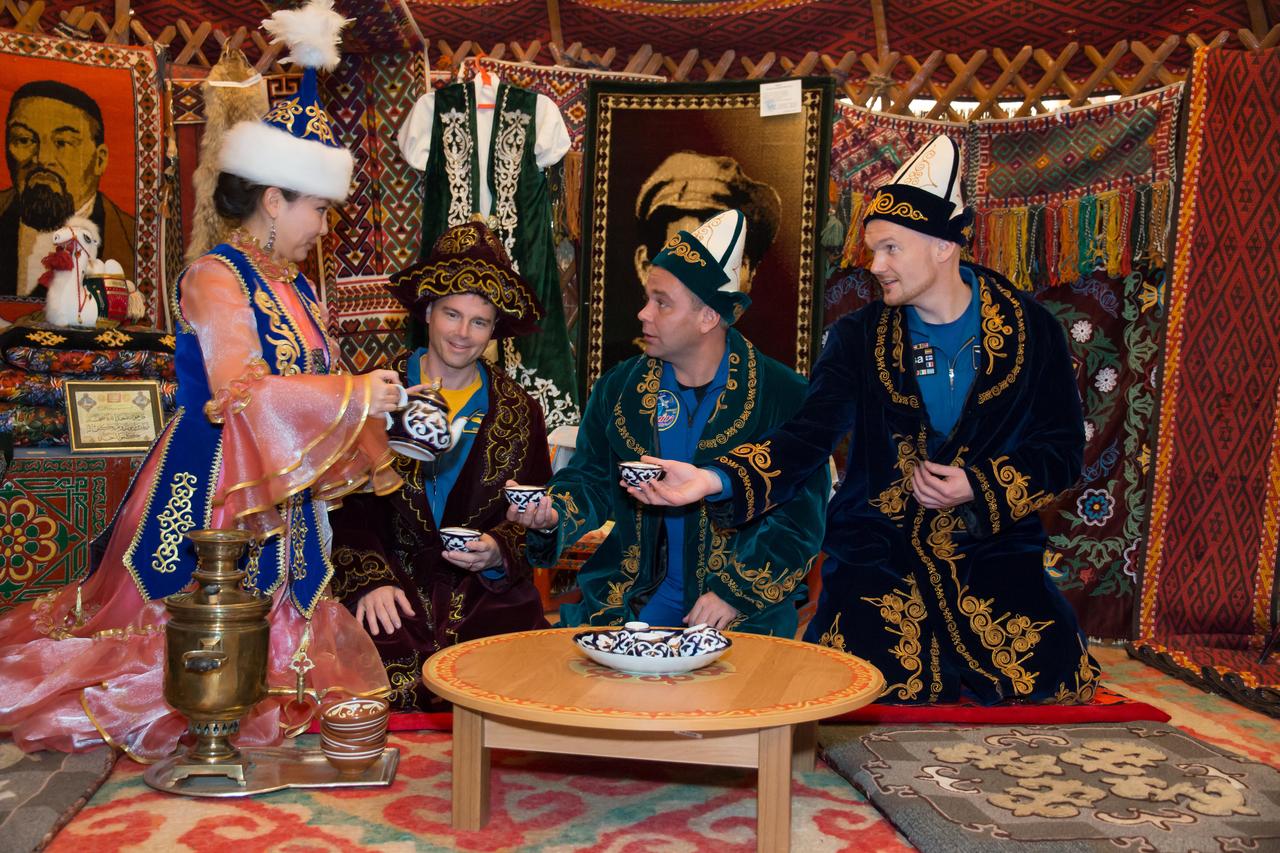 The Expedition 38/39 backup crewmembers participate in a traditional meal in a Kazakh “yurt” or tent October 27 during a tour of Baikonur, Kazakhstan. NASA’s Reid Wiseman (left), Max Suraev (center) and Alexander Gerst of the European Space Agency (right) are understudies to the prime crew, Koichi Wakata of the Japan Aerospace Exploration Agency, Soyuz Commander Mikhail Tyurin and Rick Mastracchio of NASA, who will launch Nov. 7, Kazakh time, in the Soyuz TMA-11M spacecraft from Baikonur to begin a six-month mission on the International Space Station. NASA/Victor Zelentsov