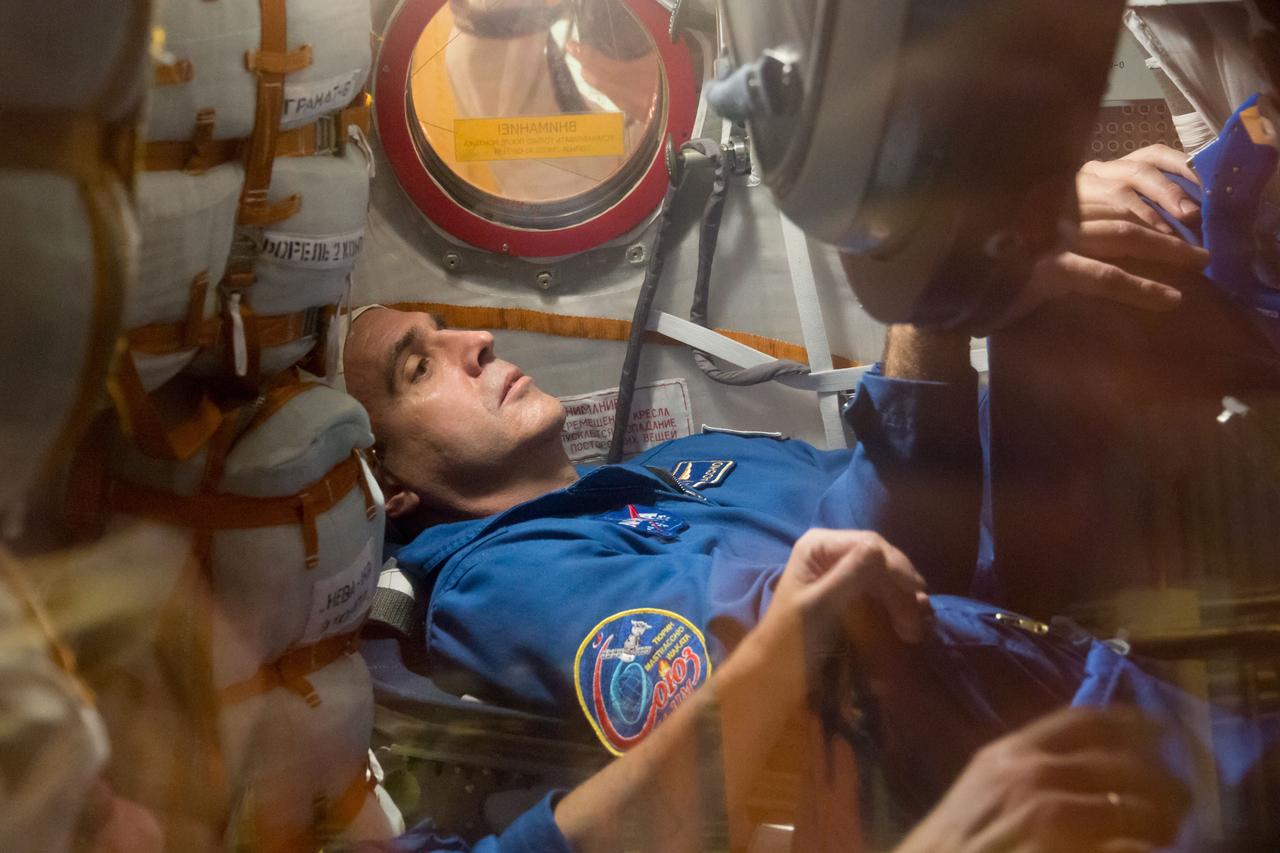 In the Integration Facility at the Baikonur Cosmodrome in Kazakhstan, Expedition 38/39 Flight Engineer Rick Mastracchio of NASA conducts a fit check dress rehearsal October 28 inside the Soyuz TMA-11M spacecraft. Mastracchio, Soyuz Commander Mikhail Tyurin and Flight Engineer Koichi Wakata of the Japan Aerospace Exploration Agency will launch Nov. 7, Kazakh time, in the Soyuz from Baikonur to begin a six-month mission on the International Space Station. NASA/Victor Zelentsov