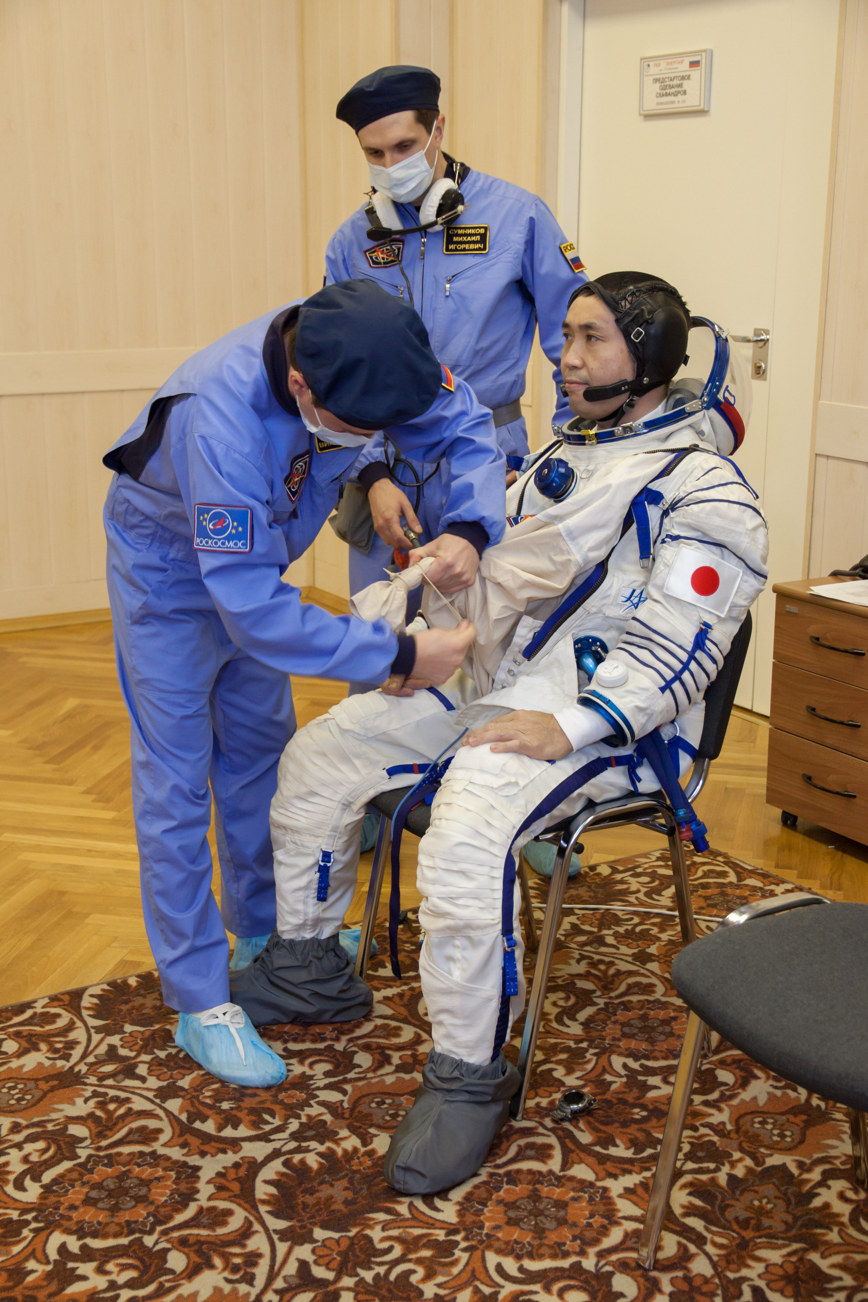 In the Integration Facility at the Baikonur Cosmodrome in Kazakhstan, Expedition 38/39 Flight Engineer Koichi Wakata of the Japan Aerospace Exploration Agency suits up for a fit check dress rehearsal in the Soyuz TMA-11M spacecraft October 28. Wakata, Soyuz Commander Mikhail Tyurin and Flight Engineer Rick Mastracchio of NASA will launch Nov. 7, Kazakh time, in the Soyuz spacecraft from Baikonur to begin a six-month mission on the International Space Station. NASA/Victor Zelentsov