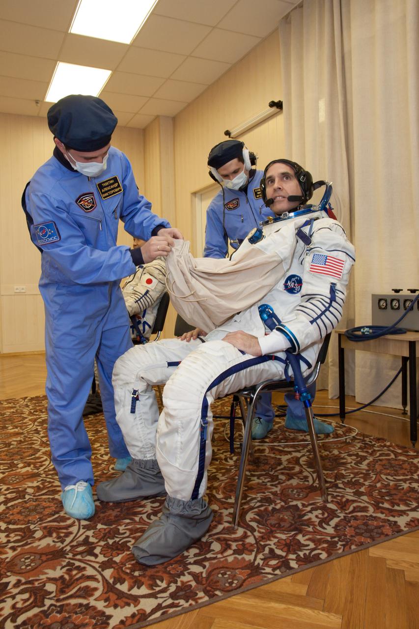 In the Integration Facility at the Baikonur Cosmodrome in Kazakhstan, Expedition 38/39 Flight Engineer Rick Mastracchio of NASA suits up for a fit check dress rehearsal in the Soyuz TMA-11M spacecraft October 28. Mastracchio, Soyuz Commander Mikhail Tyurin and Flight Engineer Koichi Wakata of the Japan Aerospace Exploration Agency will launch Nov. 7, Kazakh time, in the Soyuz spacecraft from Baikonur to begin a six-month mission on the International Space Station. NASA/Victor Zelentsov