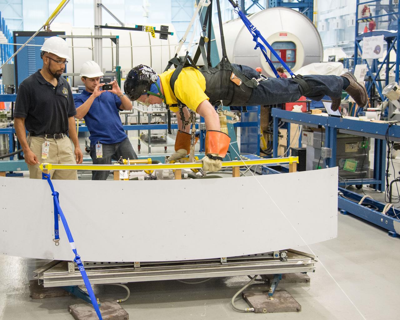  PHOTO DATE:  10-30-13 LOCATION:  Bldg. 9NW - POGO Stand  SUBJECT: Expedition 43 commander and crew member Terry Virts during his ISS EVA POGO 1 training on the POGO stand with instructors Faruq Sabur and Alexandros Kanelakos. PHOTOGRAPHER: BILL STAFFORD