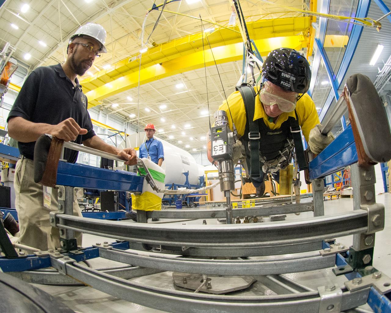  PHOTO DATE:  10-30-13 LOCATION:  Bldg. 9NW - POGO Stand  SUBJECT: Expedition 43 commander and crew member Terry Virts during his ISS EVA POGO 1 training on the POGO stand with instructors Faruq Sabur and Alexandros Kanelakos. PHOTOGRAPHER: BILL STAFFORD