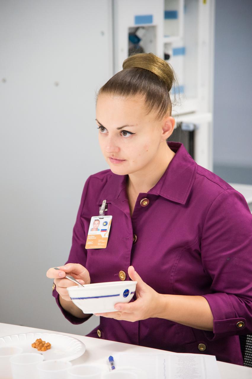Date: 10-30-13 Location: Bldg 17, rm 1070 Subject: Expedition 41/42 crew member Elena Serova during her food tasting session in the JSC Food Lab Photographer: James Blair