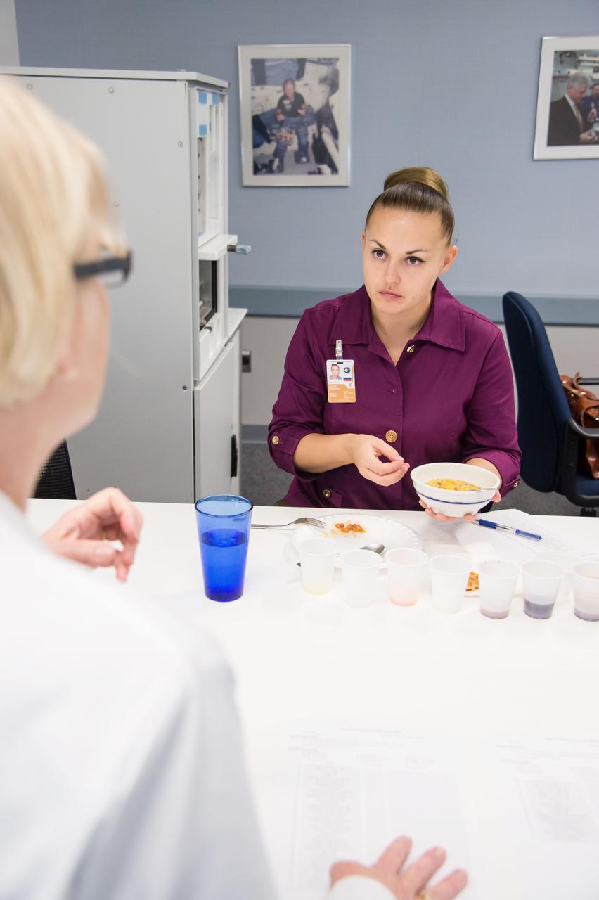Date: 10-30-13 Location: Bldg 17, rm 1070 Subject: Expedition 41/42 crew member Elena Serova during her food tasting session in the JSC Food Lab Photographer: James Blair