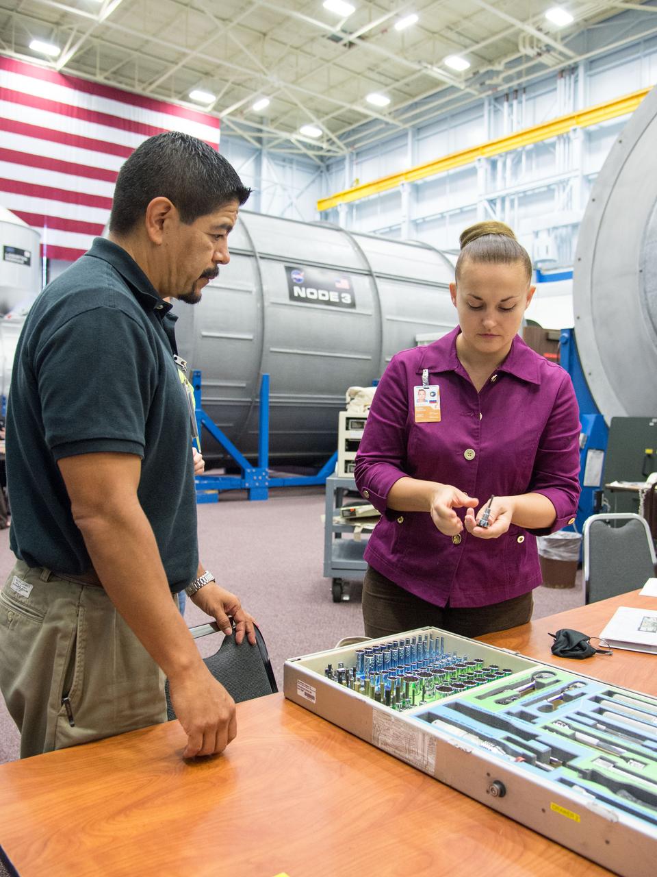 Date: 10-30-13 Location: Bldg 9NW, ISS Mockup Subject:  Expedition 41/42 crew member and RSA cosmonaut Elena Serova during rack and hatch skills training in ISS mockups.  Photographer: James Blair