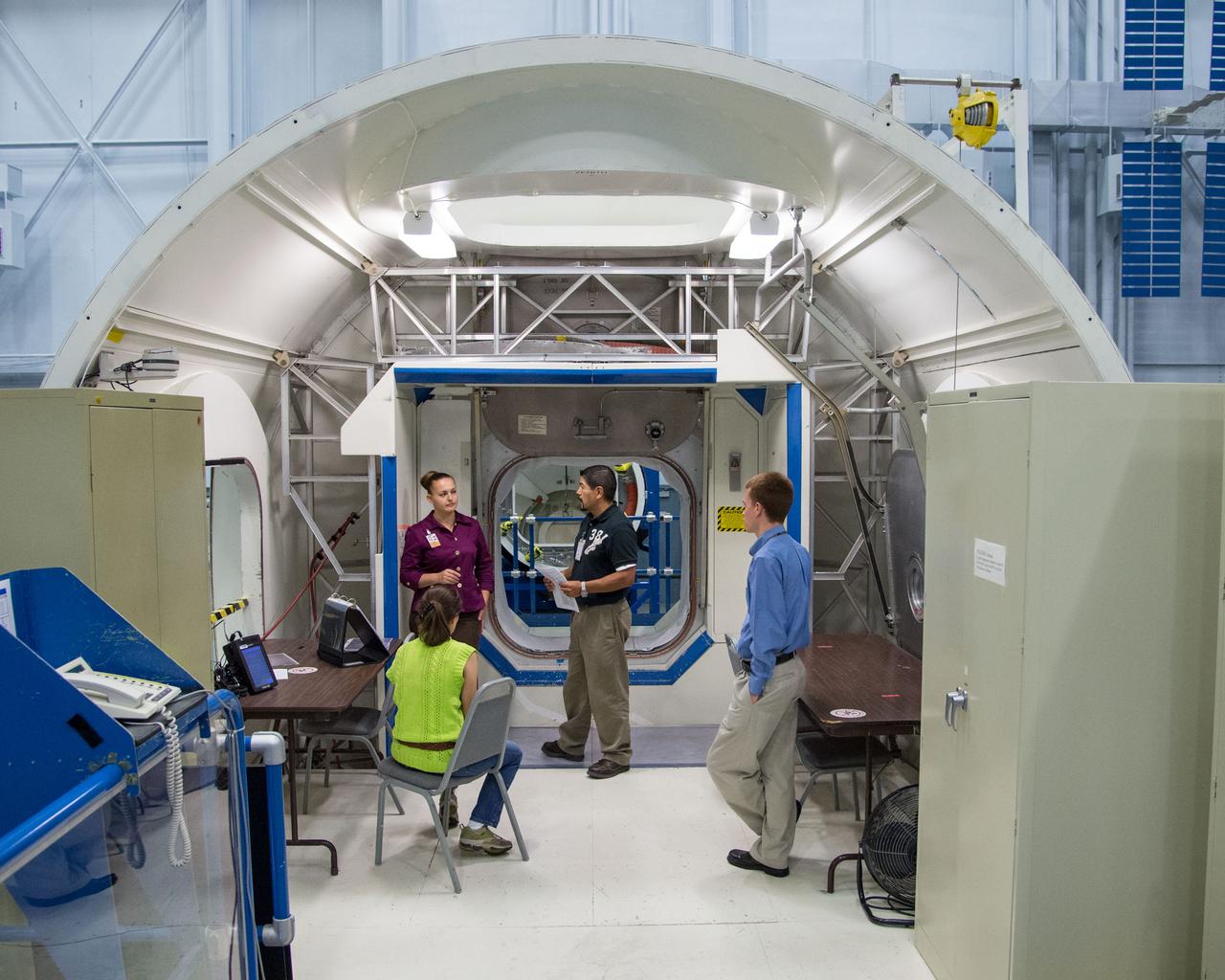 Date: 10-30-13 Location: Bldg 9NW, ISS Mockup Subject:  Expedition 41/42 crew member and RSA cosmonaut Elena Serova during rack and hatch skills training in ISS mockups.  Photographer: James Blair