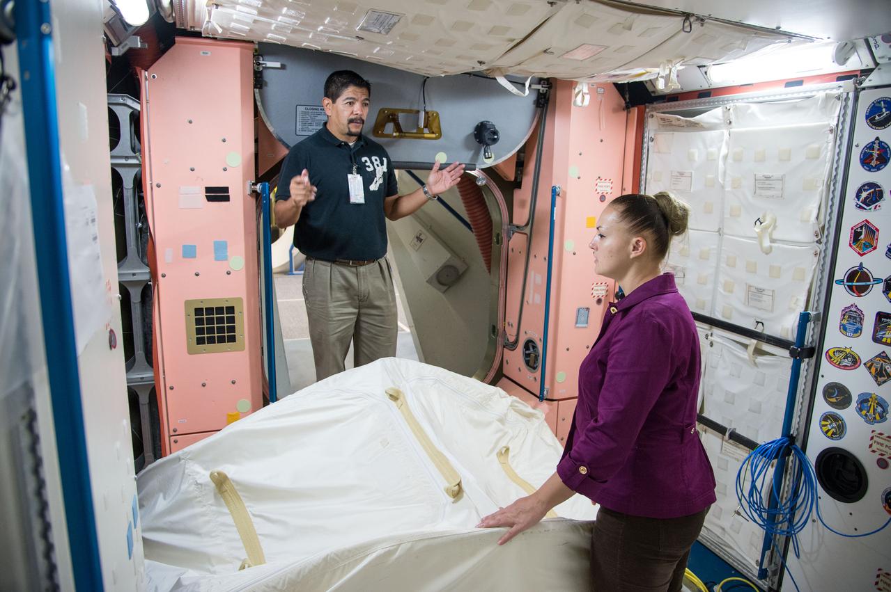 Date: 10-30-13 Location: Bldg 9NW, ISS Mockup Subject:  Expedition 41/42 crew member and RSA cosmonaut Elena Serova during rack and hatch skills training in ISS mockups.  Photographer: James Blair