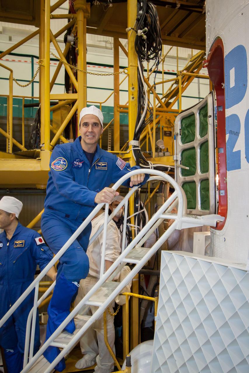 11-11-56: In the Integration Facility at the Baikonur Cosmodrome in Kazakhstan, Expedition 38/39 Flight Engineer Rick Mastracchio of NASA climbs aboard the Soyuz TMA-11M spacecraft Nov. 3 during the crew’s final fit check dress rehearsal. Mastracchio, Soyuz Commander Mikhail Tyurin and Flight Engineer Koichi Wakata of the Japan Aerospace Exploration Agency will launch Nov. 7, Kazakh time, for a six-month mission on the International Space Station. NASA/Victor Zelentsov
