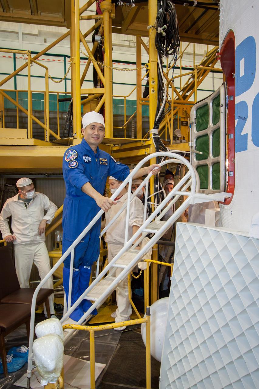 11-12-12: In the Integration Facility at the Baikonur Cosmodrome in Kazakhstan, Expedition 38/39 Flight Engineer Koichi Wakata of the Japan Aerospace Exploration Agency climbs aboard the Soyuz TMA-11M spacecraft Nov. 3 during the crew’s final fit check dress rehearsal. Wakata, Soyuz Commander Mikhail Tyurin and Flight Engineer Rick Mastracchio of NASA will launch Nov. 7, Kazakh time, for a six-month mission on the International Space Station. NASA/Victor Zelentsov