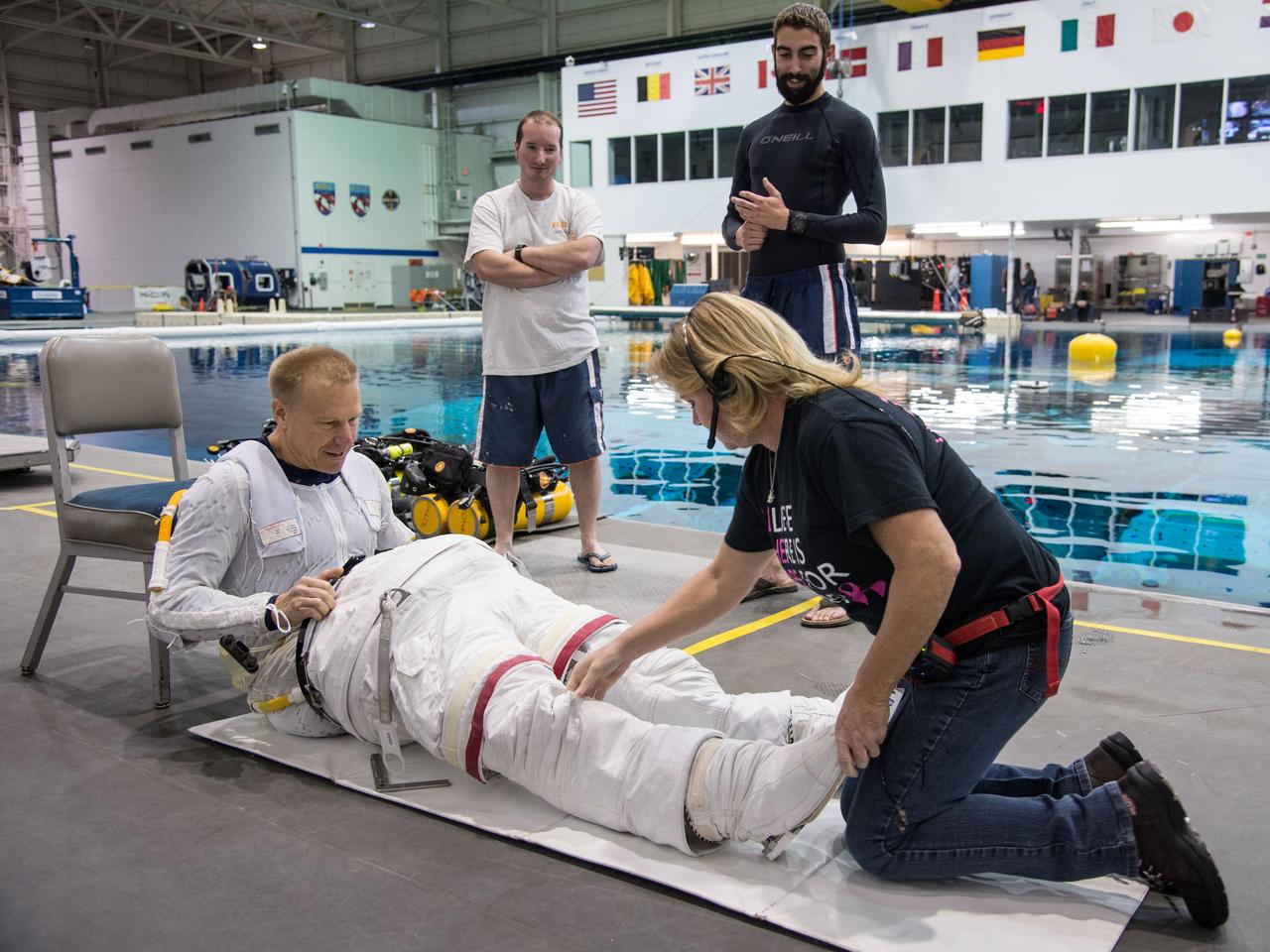 Date: 12-13-13 Location: NBL, Pool Topside Subject: Soyuz 45 crew members, Tim Kopra and ESA astronaut Tim Peake during ISS EVA Maintenance 1 - training at the NBL Photographer: James Blair/NASA