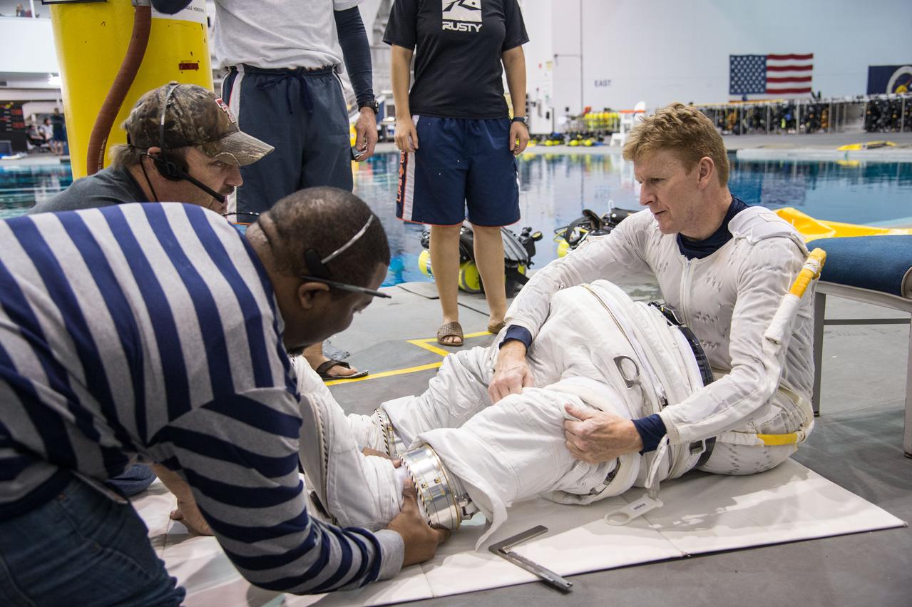 Date: 12-13-13 Location: NBL, Pool Topside Subject: Soyuz 45 crew members, Tim Kopra and ESA astronaut Tim Peake during ISS EVA Maintenance 1 - training at the NBL Photographer: James Blair/NASA