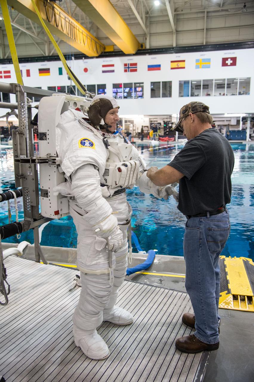 Date: 12-13-13 Location: NBL, Pool Topside Subject: Soyuz 45 crew members, Tim Kopra and ESA astronaut Tim Peake during ISS EVA Maintenance 1 - training at the NBL Photographer: James Blair/NASA