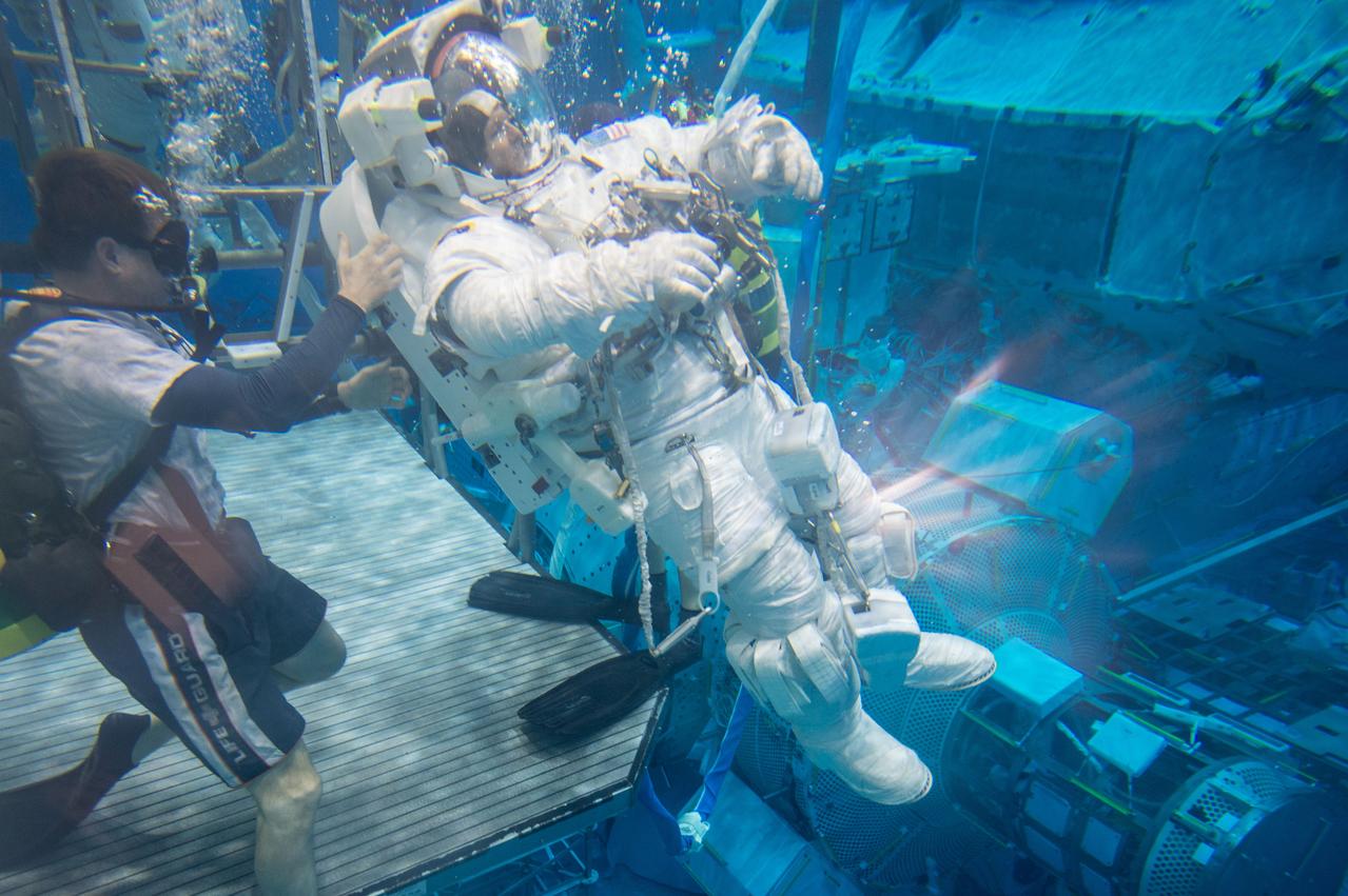 Date: 12-13-13 Location: NBL, Pool Topside Subject: Soyuz 45 crew members, Tim Kopra and ESA astronaut Tim Peake during ISS EVA Maintenance 1 - training at the NBL Photographer: James Blair/NASA