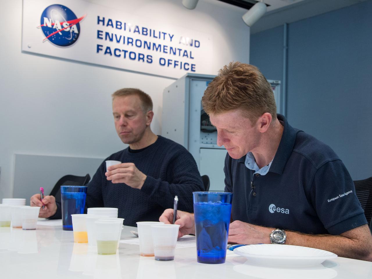 Date: 12-17-13 Location: Bldg 17, rm 1070 Food Lab Subject: Soyuz 45 crew members, Tim Kopra and ESA astronaut Tim Peake during food tasting in the JSC Food Lab Photographer: James Blair