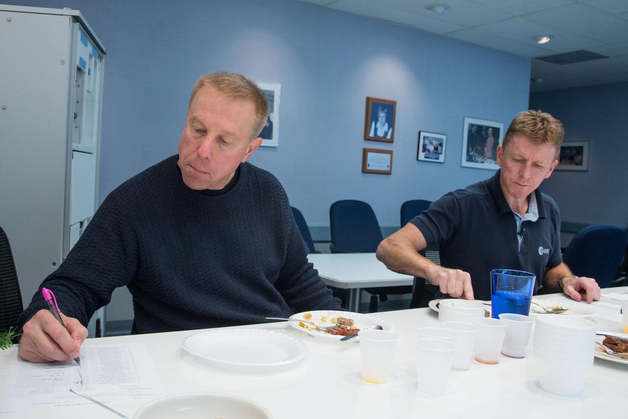 Date: 12-17-13 Location: Bldg 17, rm 1070 Food Lab Subject: Soyuz 45 crew members, Tim Kopra and ESA astronaut Tim Peake during food tasting in the JSC Food Lab Photographer: James Blair