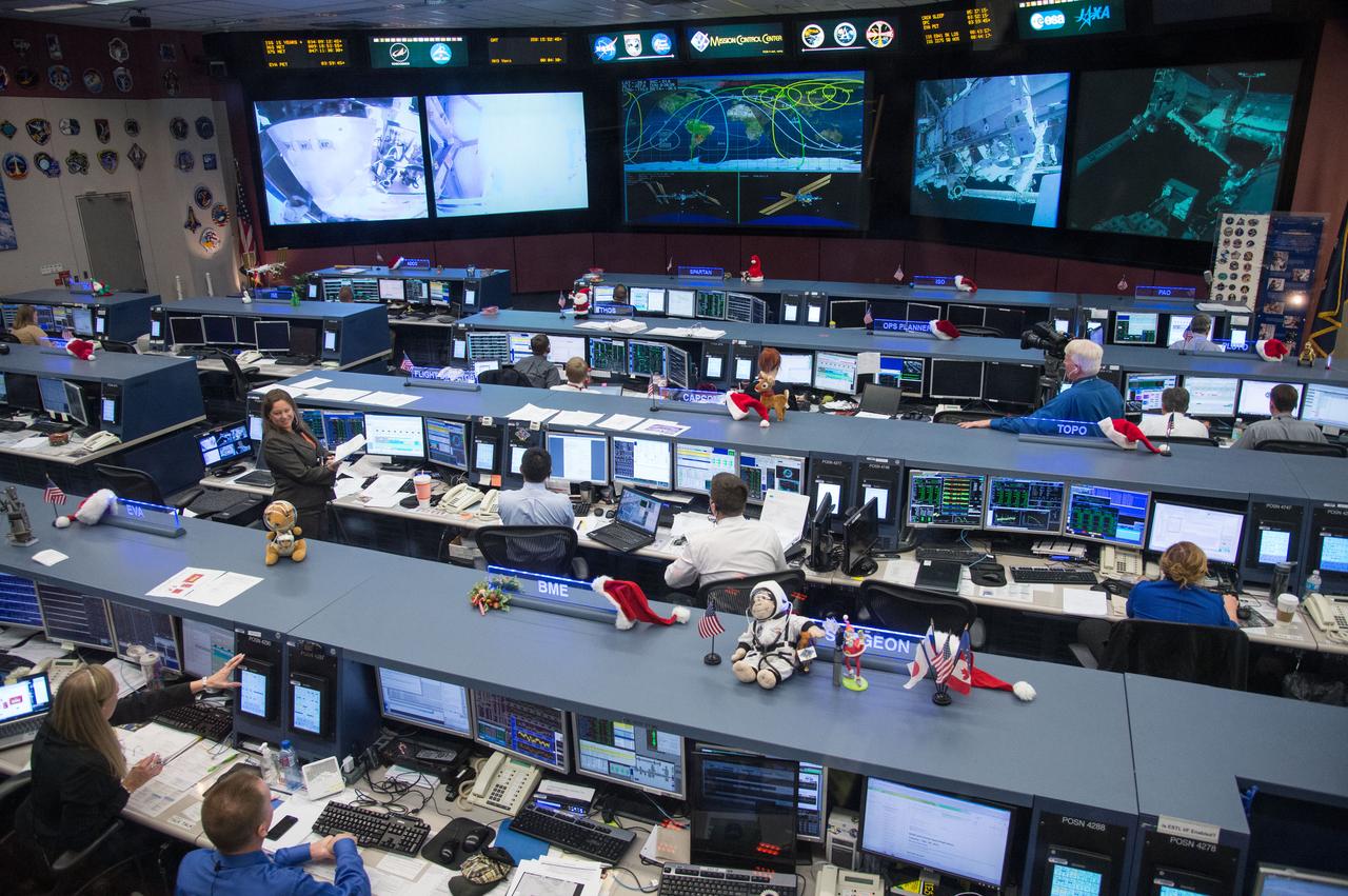 DATE: 12-24-13 LOCATION:   Bldg. 30 - FCR-1 (30M/231)  SUBJECT: ISS Flight Controllers during Expedition 38's 2nd Spacewalk to repair a faulty ISS Coolant pump with Astronauts Rick Mastracchio and Mike Hopkins. Flight Director: Dina Contella, Capcom's Doug Wheelock, Aki Hoshide, and Lead U.S. Spacewalk Officer Allison Bolinger. PHOTOGRAPHER: Lauren Harnett